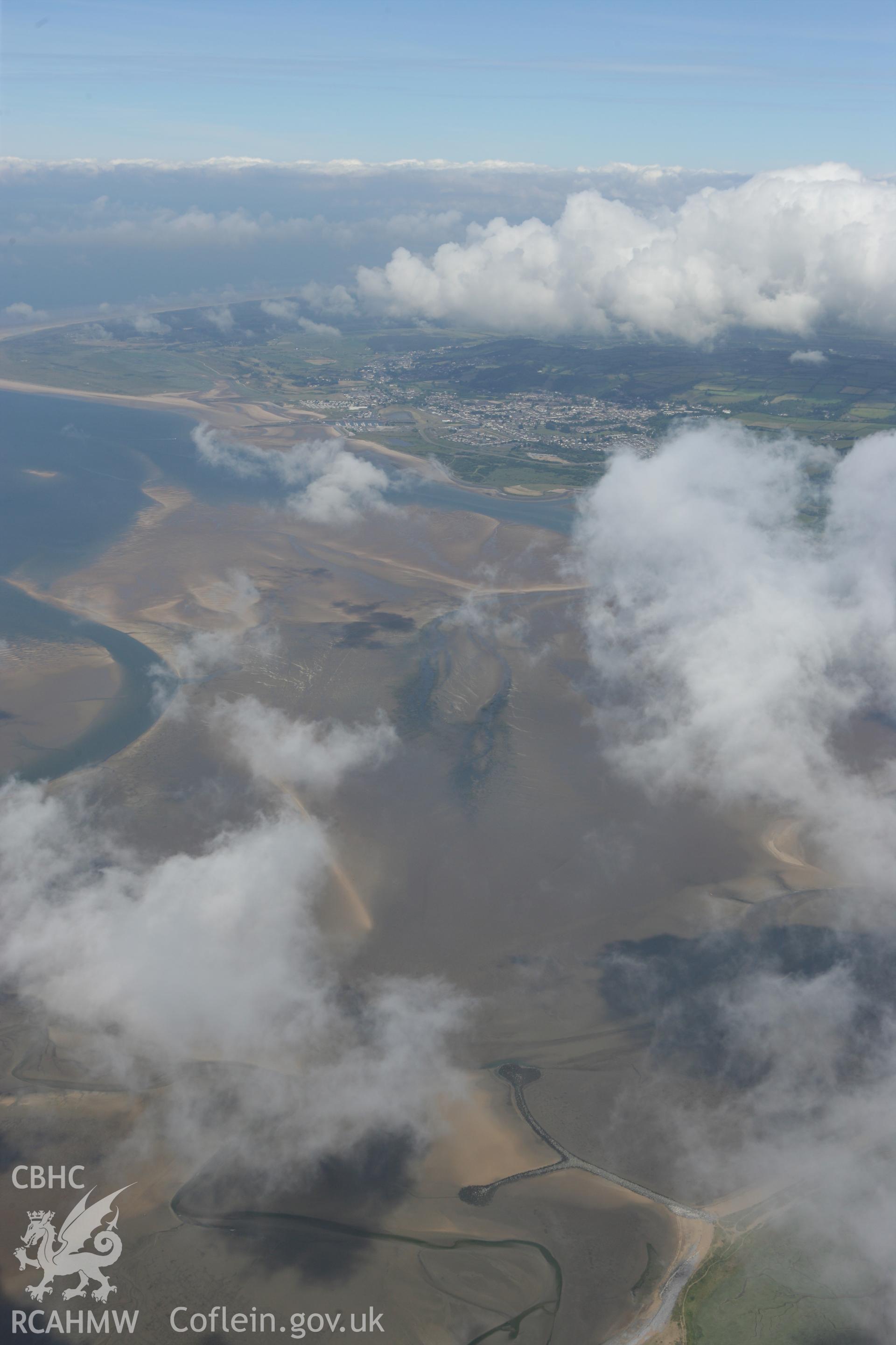 RCAHMW colour oblique photograph of Breakwaters, west of Llanelli, with Burry Port in the distance. Taken by Toby Driver on 22/06/2010.