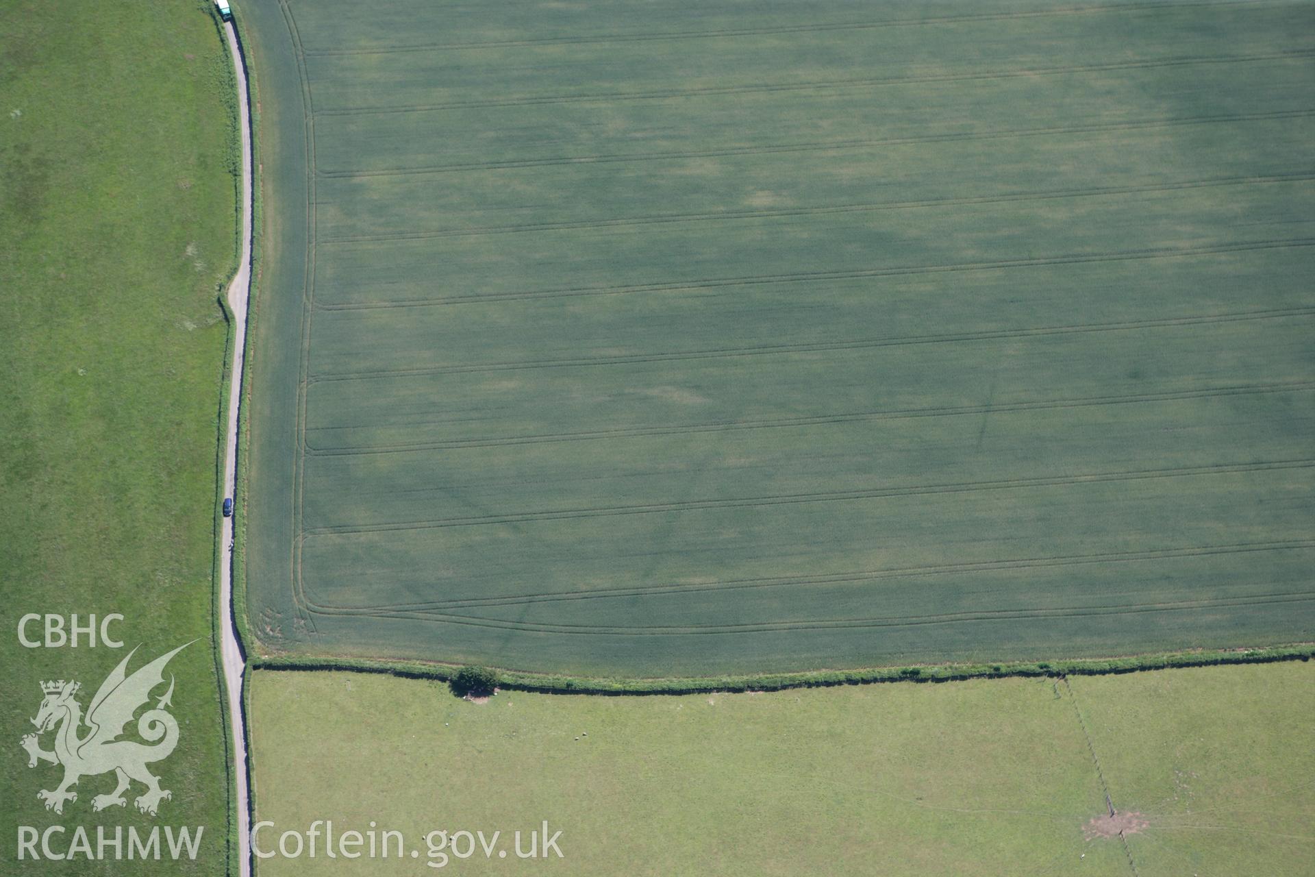 RCAHMW colour oblique photograph of Five Lanes cropmark of ditched enclosure. Taken by Toby Driver on 21/06/2010.