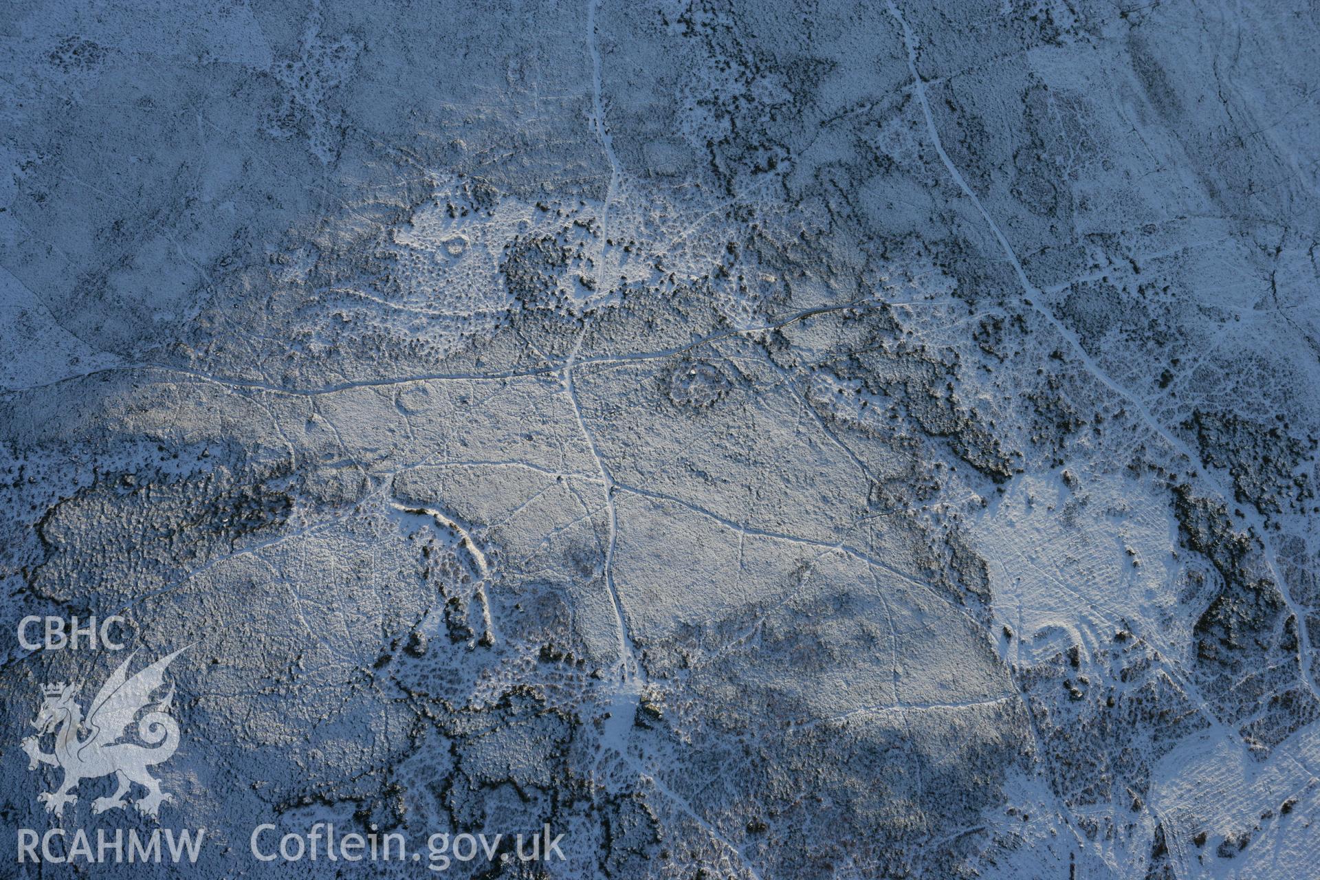 RCAHMW colour oblique photograph of Ancient settlement on the northern slopes of Mynydd Carn Ingli. Taken by Toby Driver on 01/12/2010.