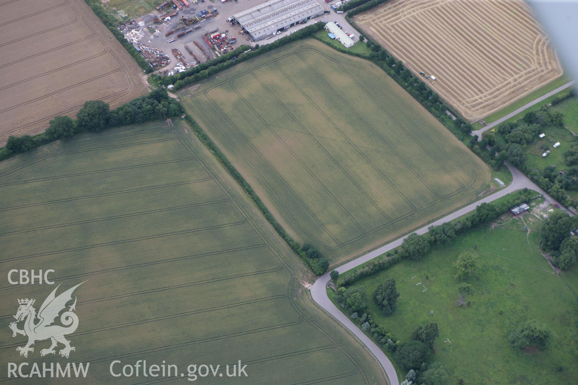 RCAHMW colour oblique photograph of Llancayo Farm Cropmark Enclosures. Taken by Toby Driver on 29/07/2010.