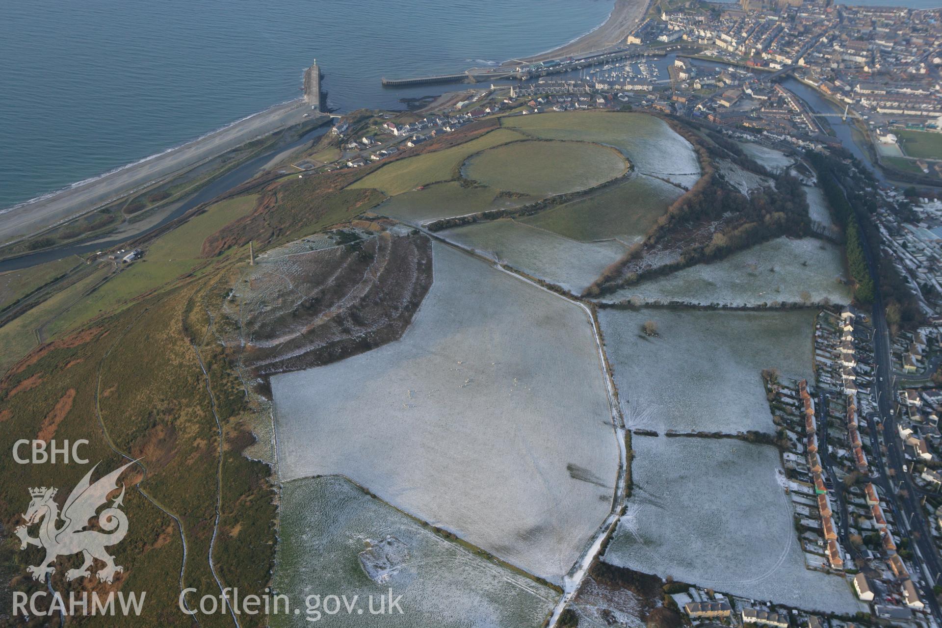 RCAHMW colour oblique photograph of Pen Dinas hillfort, with snow. Taken by Toby Driver on 02/12/2010.