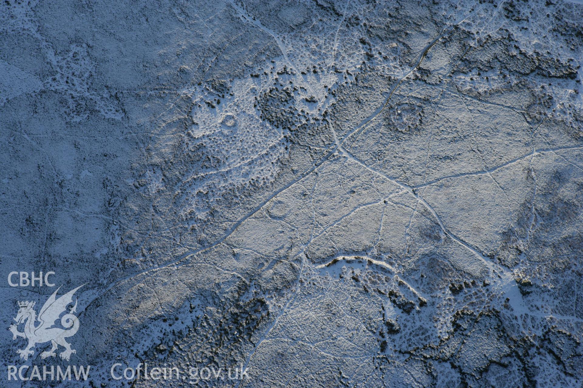 RCAHMW colour oblique photograph of Ancient settlement on the northern slopes of Mynydd Carn Ingli. Taken by Toby Driver on 01/12/2010.