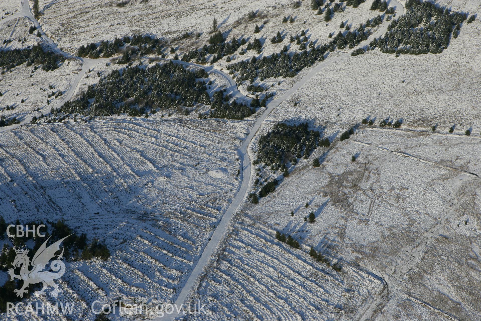 RCAHMW colour oblique photograph of Cnwc III barrow. Taken by Toby Driver on 01/12/2010.