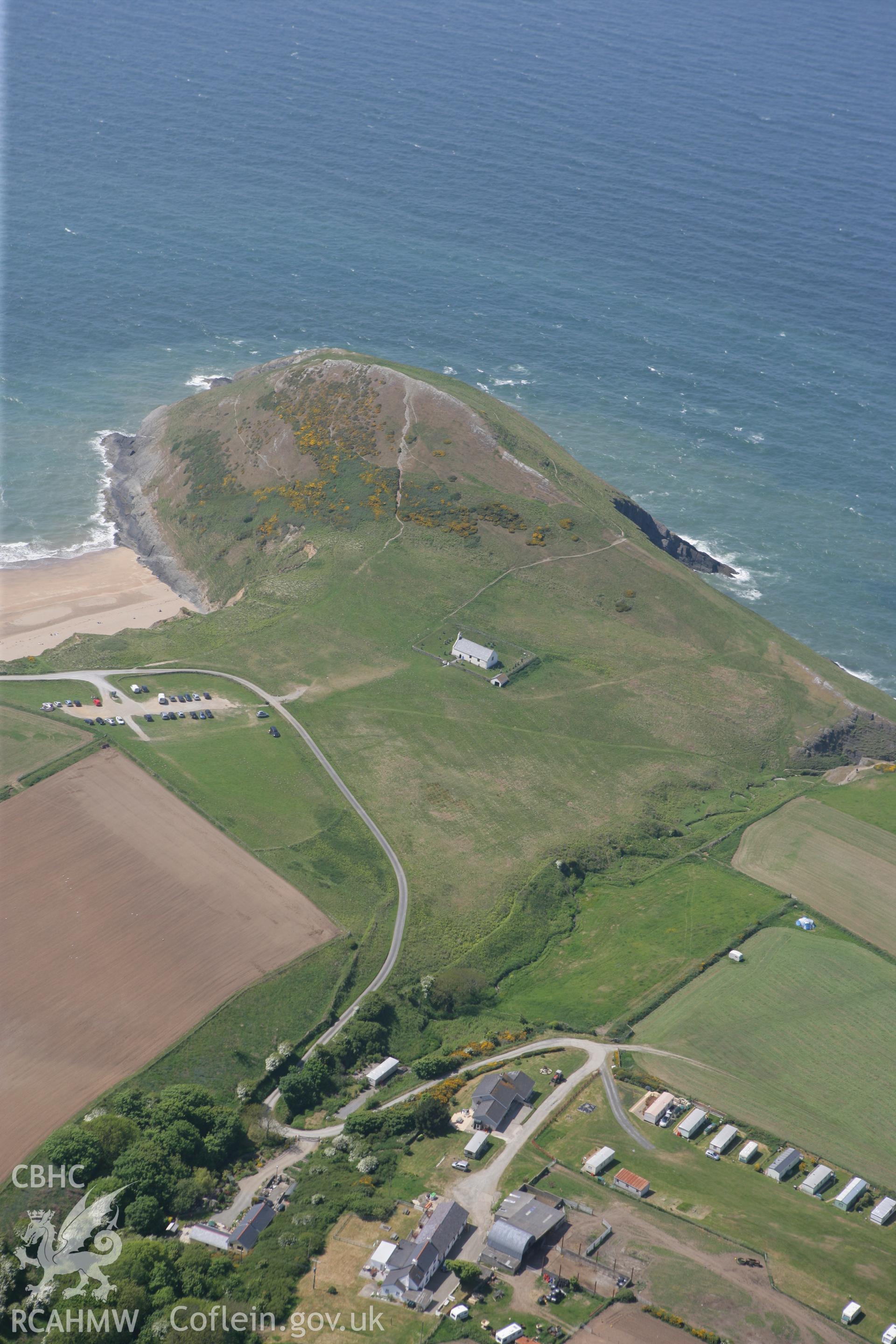 RCAHMW colour oblique photograph of Mwnt, promontory fort and church. Taken by Toby Driver on 25/05/2010.