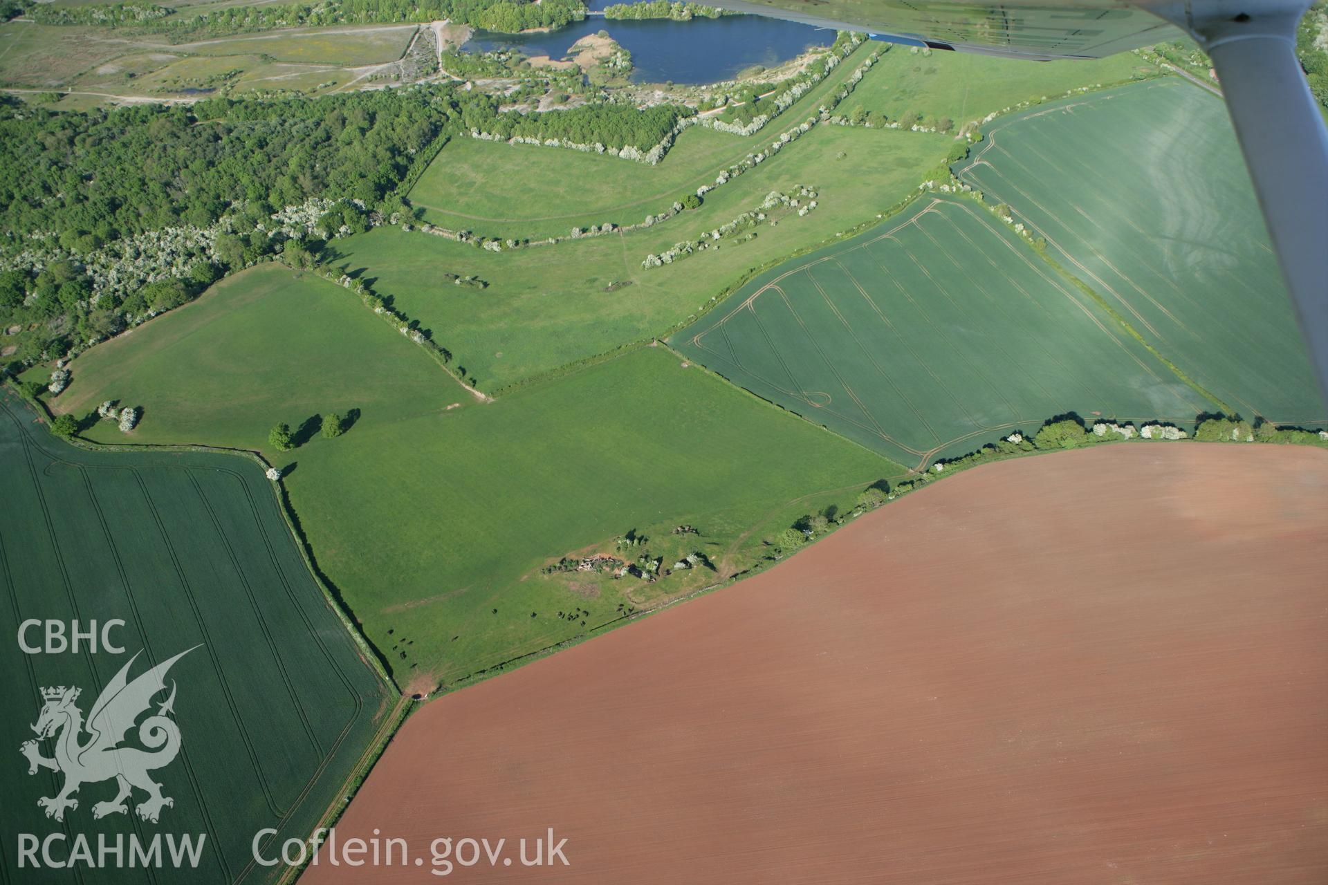 RCAHMW colour oblique photograph of the site of Neolithic and Mesolithic Flint Scatter finds. Taken by Toby Driver on 24/05/2010.