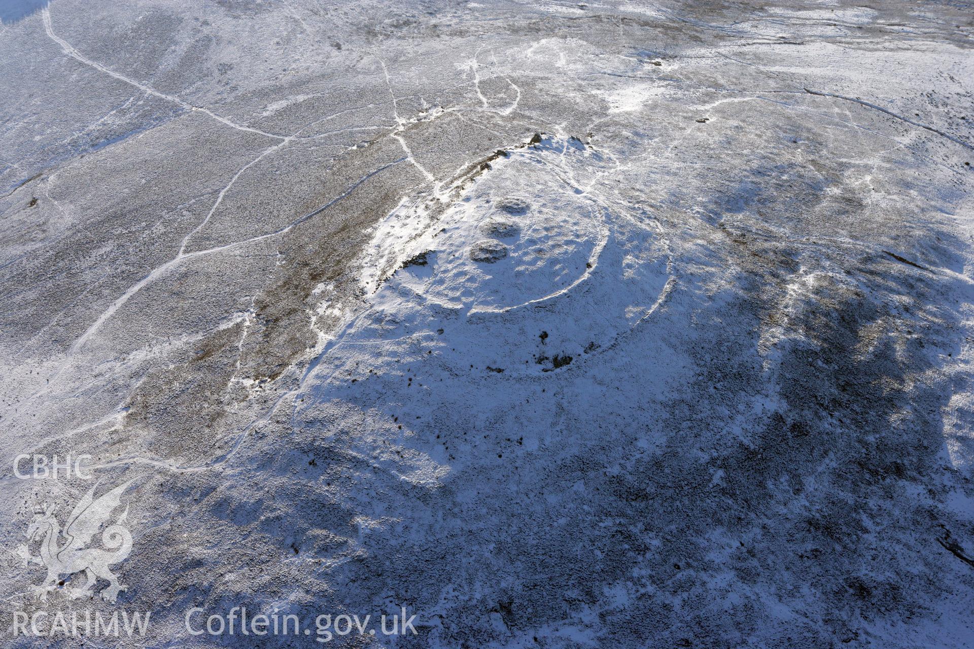 RCAHMW colour oblique aerial photograph of Foel Drygarn hillfort under snow, by Toby Driver, 01/12/2010.