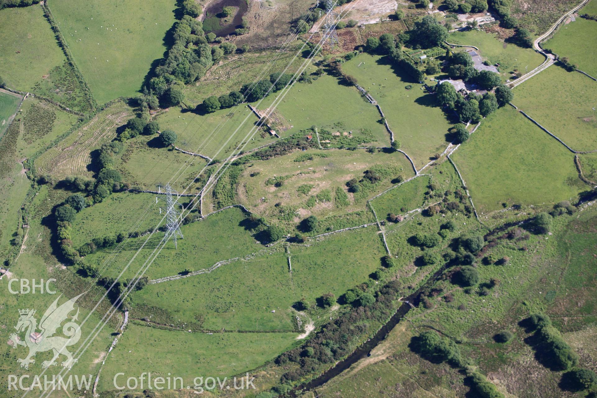 RCAHMW colour oblique photograph of Caer Engan Hillfort. Taken by Toby Driver on 16/06/2010.