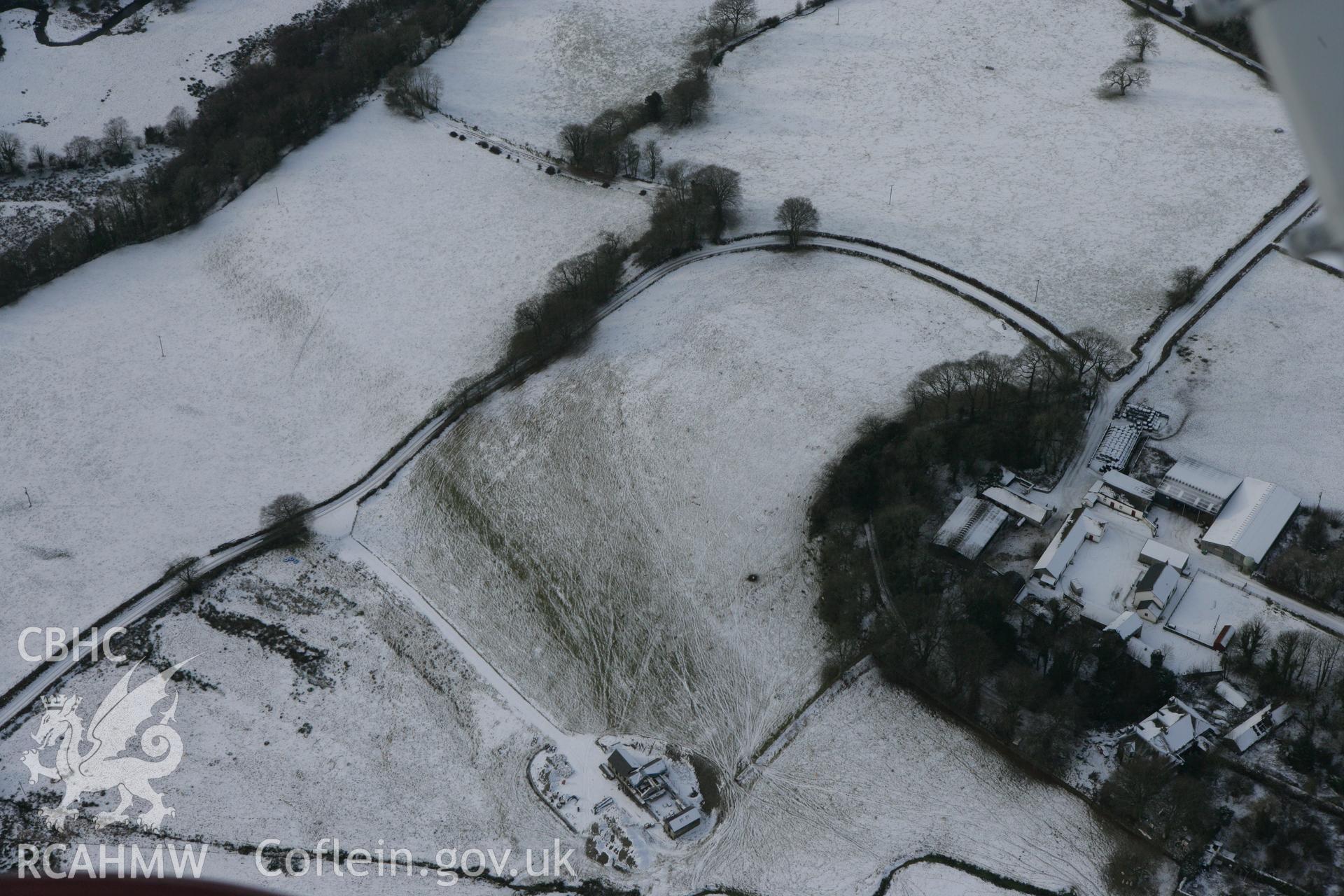 RCAHMW colour oblique photograph of Neuadd-fawr, possible curving earthwork of garden landscaping. Taken by Toby Driver on 02/12/2010.
