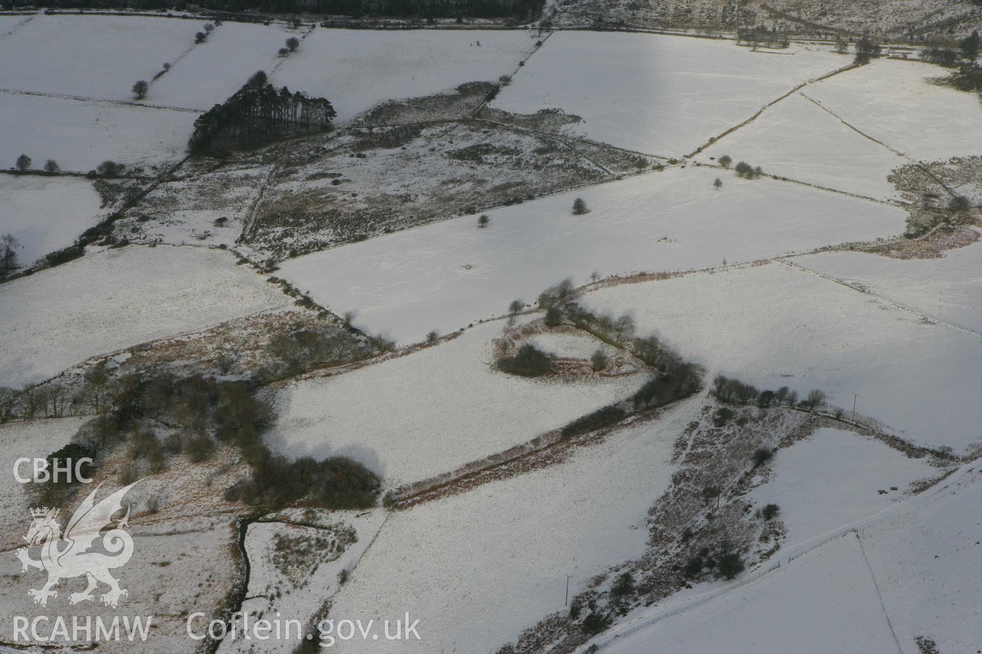 RCAHMW colour oblique photograph of Garreg Lwyd, defended enclosure. Taken by Toby Driver on 02/12/2010.