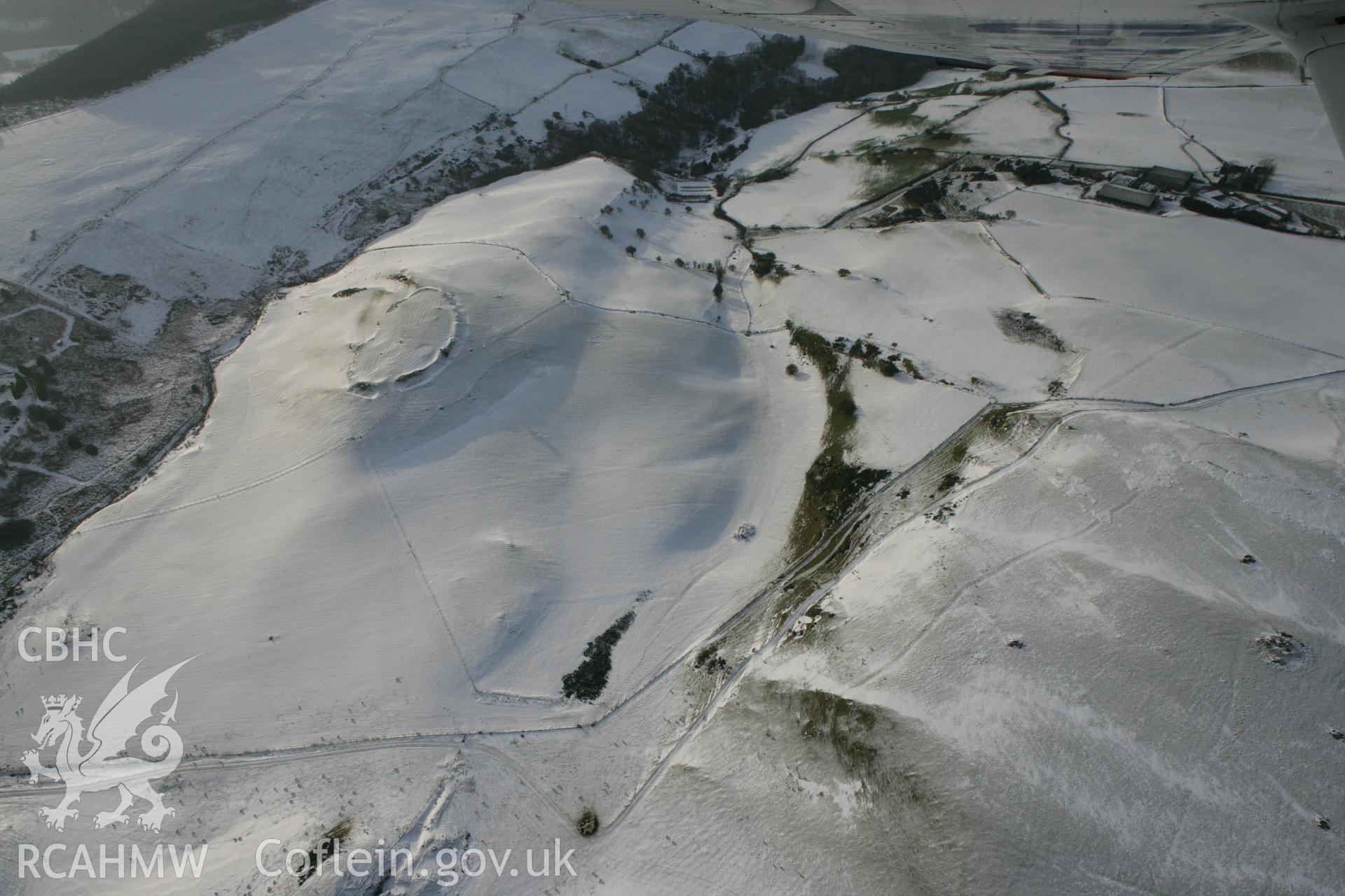 RCAHMW colour oblique photograph of Pen y Castell hillfort. Taken by Toby Driver on 02/12/2010.