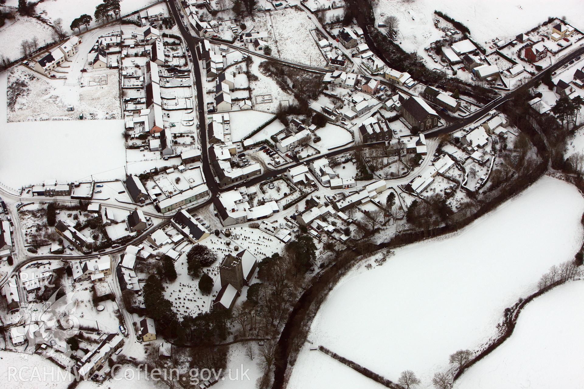 RCAHMW colour oblique aerial photograph of Llanddewi Brefi under snow, by Toby Driver, 02/12/2010.