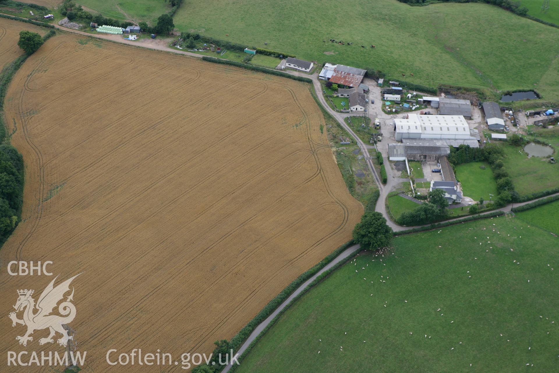 RCAHMW colour oblique photograph of rectangular cropmark enclosure, Pen-y-Parc Farm. Taken by Toby Driver on 29/07/2010.