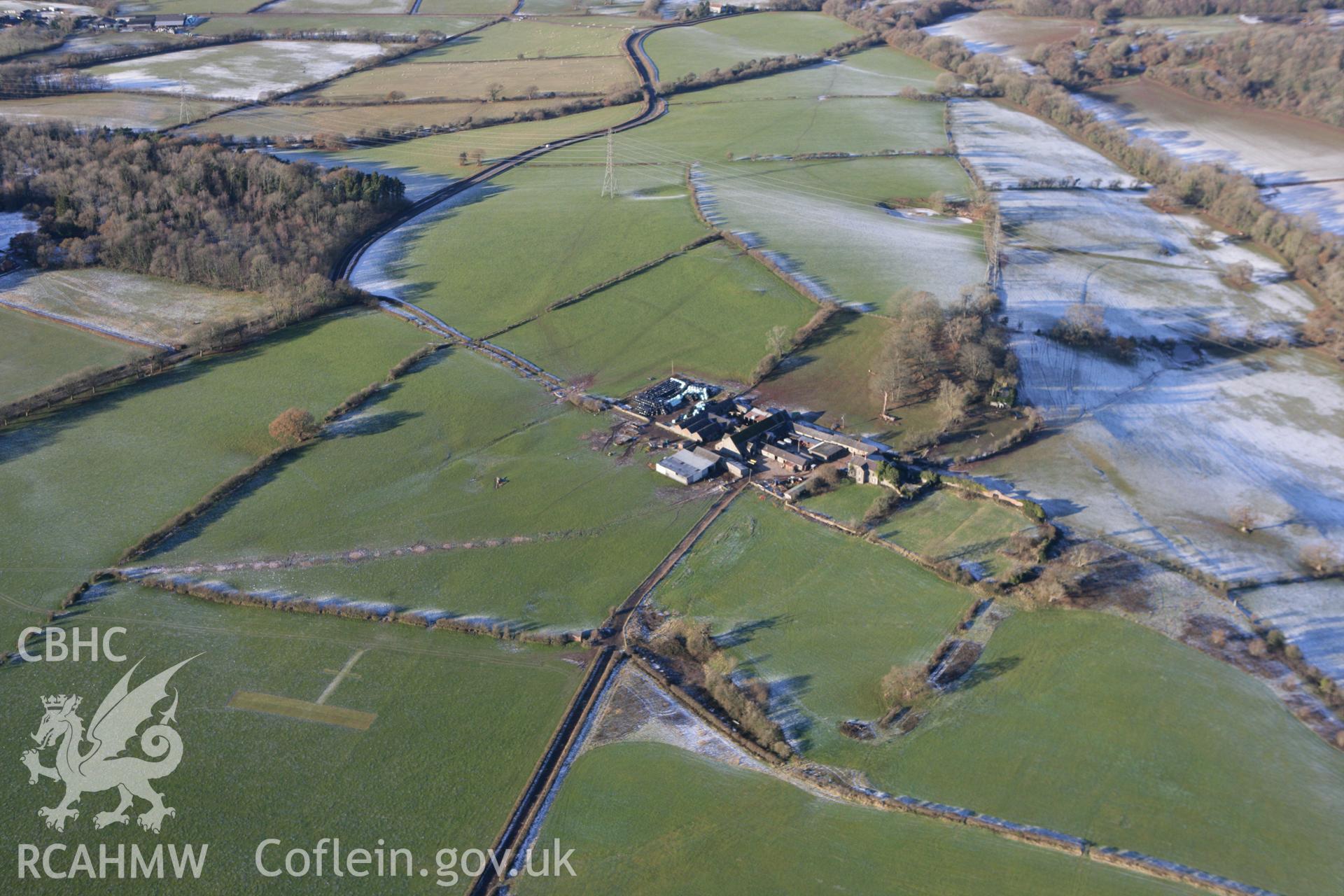 RCAHMW colour oblique photograph of Pentrebane, with possible undated earthworks to the south-west. Taken by Toby Driver on 08/12/2010.