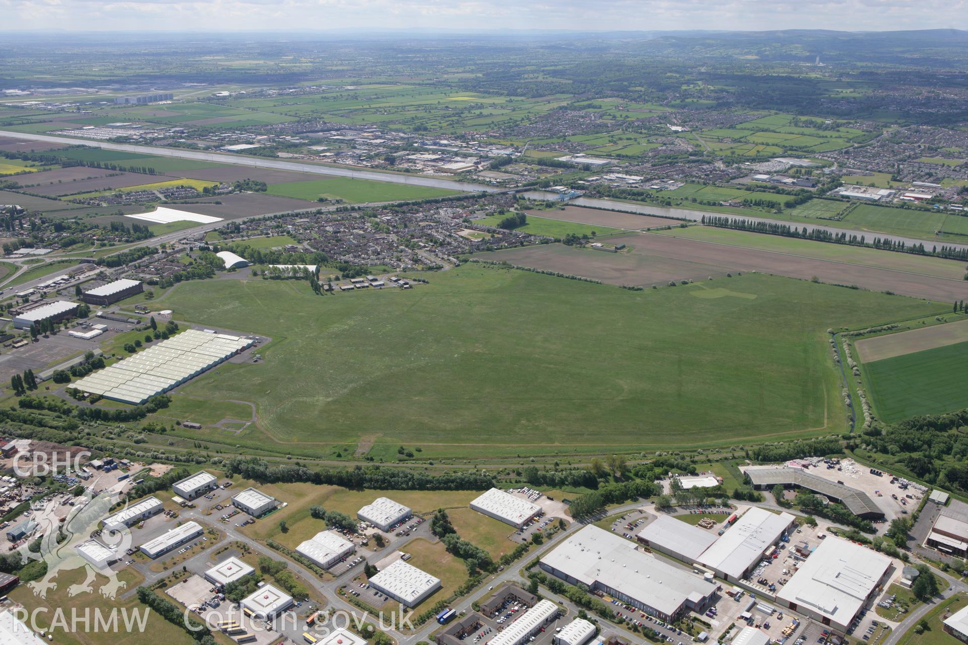 RCAHMW colour oblique photograph of Sealand Airfield, looking south towards Garden City. Taken by Toby Driver on 27/05/2010.