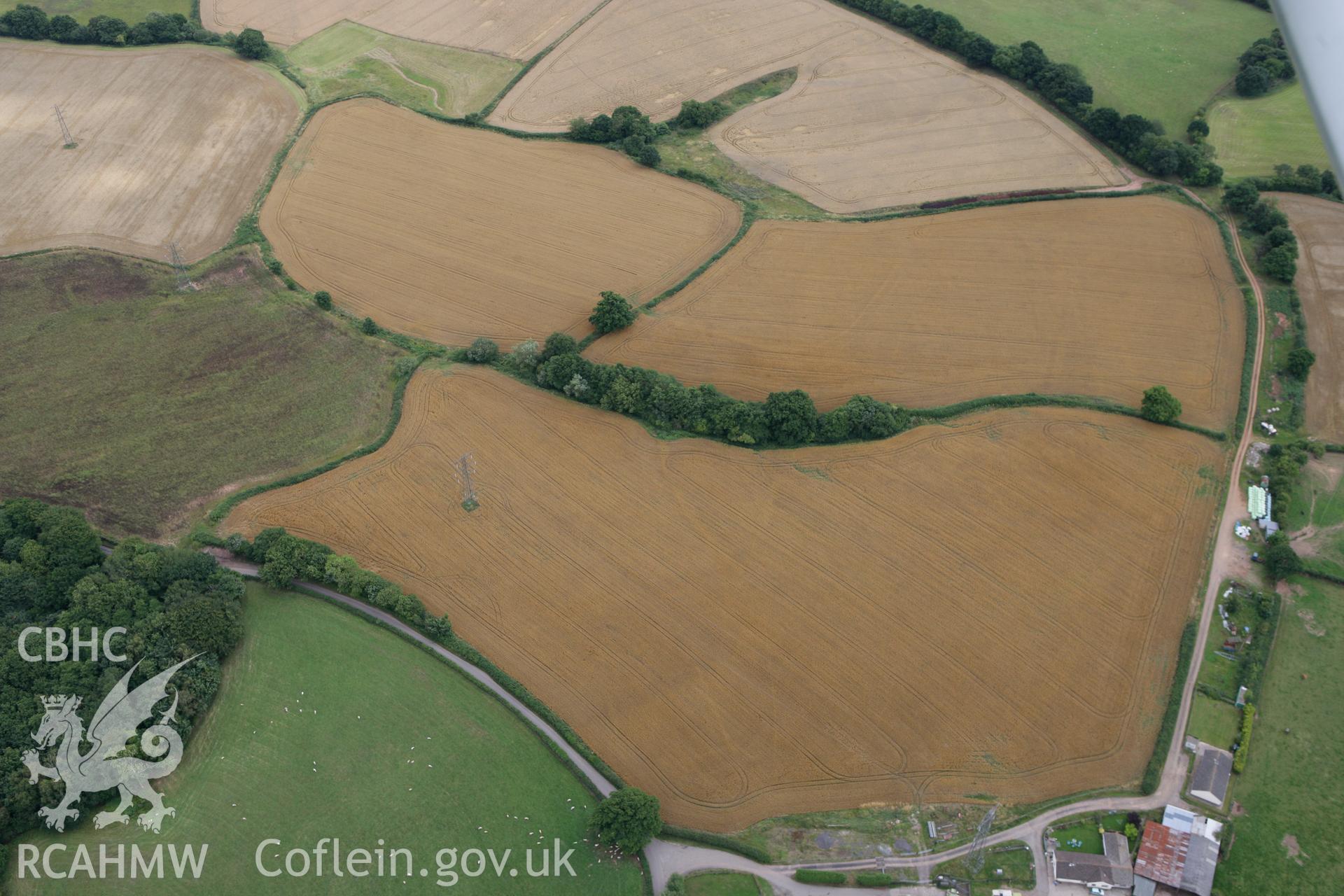 RCAHMW colour oblique photograph of rectangular cropmark enclosure, Pen-y-Parc Farm. Taken by Toby Driver on 29/07/2010.