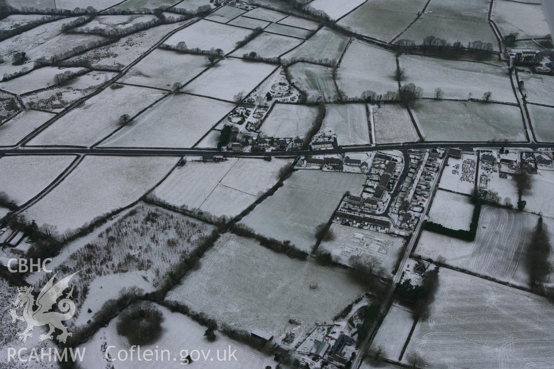 RCAHMW colour oblique photograph of Castell Nonni (Castell Prysg), showing a wide view. Taken by Toby Driver on 02/12/2010.