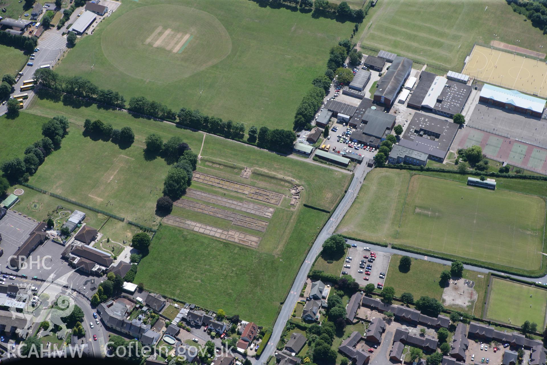 RCAHMW colour oblique photograph of Roman Barracks, Prysg fields, Caerleon. Taken by Toby Driver on 21/06/2010.