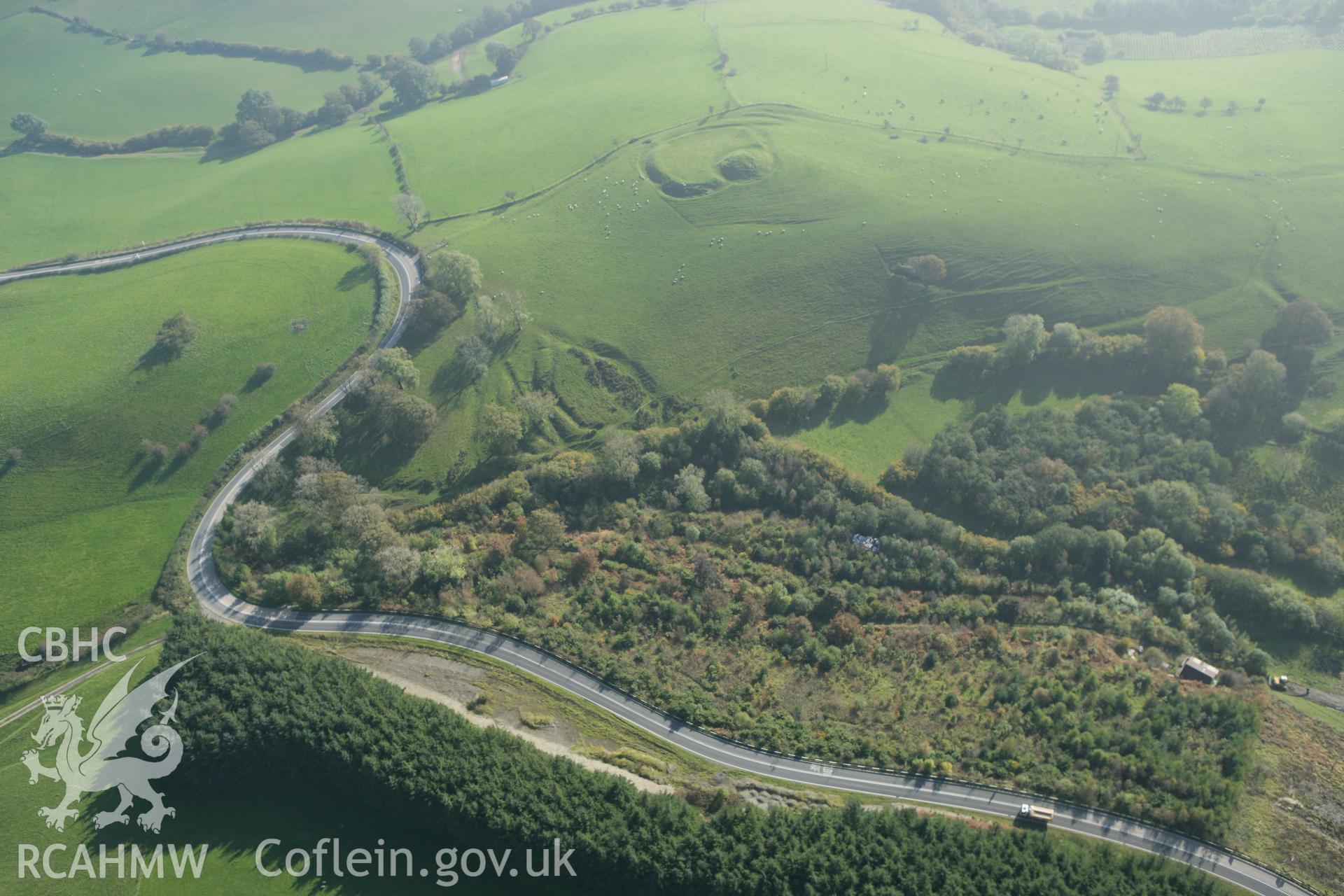 RCAHMW colour oblique photograph of Castell Crugerydd (Crug Eryr), with earthworks of relict road. Taken by Toby Driver on 13/10/2010.