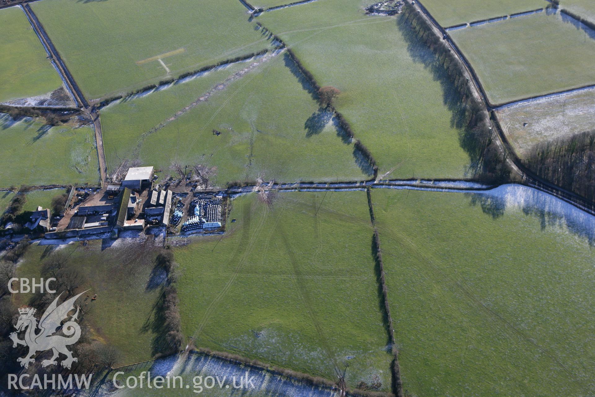 RCAHMW colour oblique photograph of Pentrebane, with possible undated earthworks to the south-west. Taken by Toby Driver on 08/12/2010.