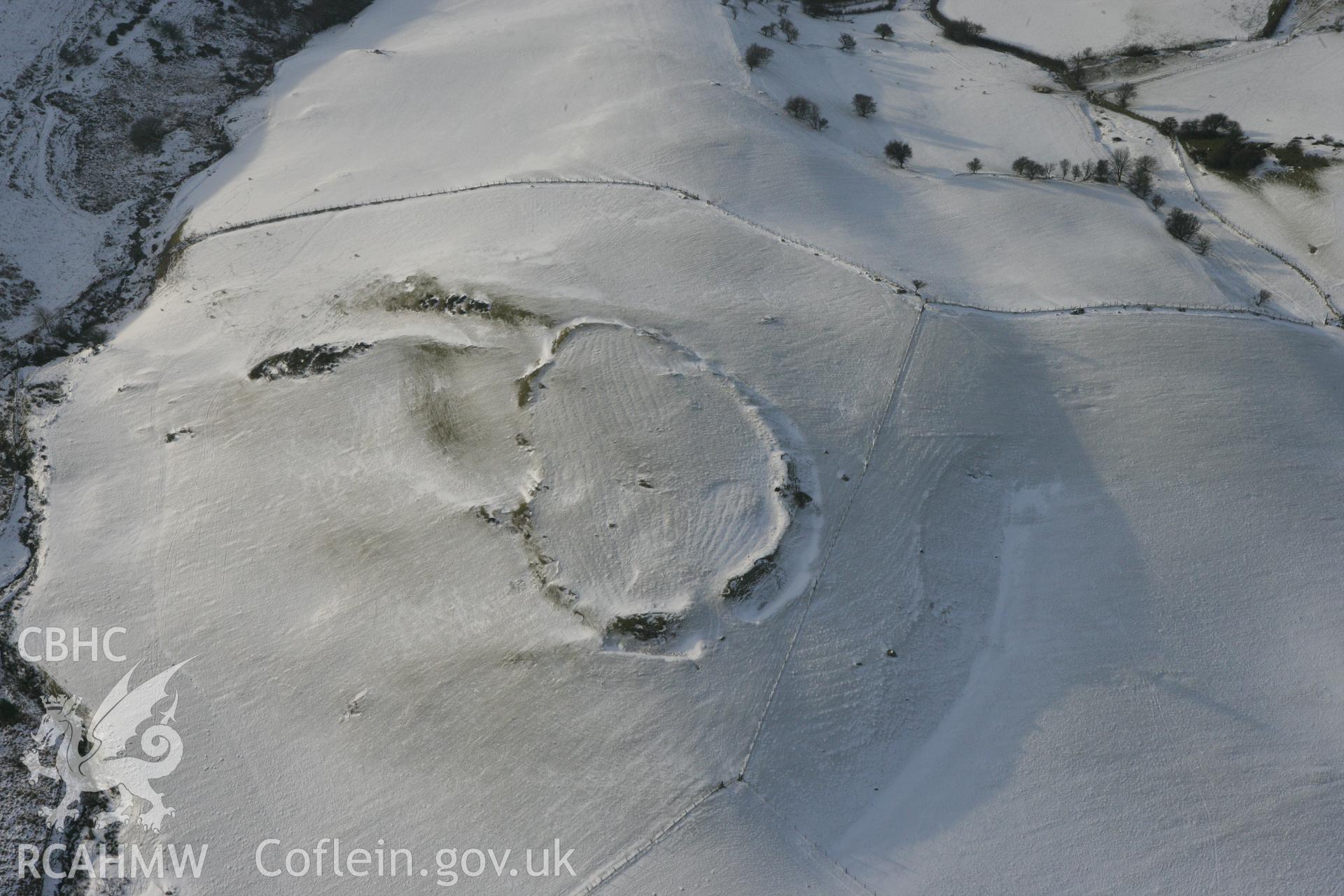 RCAHMW colour oblique photograph of Pen y Castell hillfort. Taken by Toby Driver on 02/12/2010.