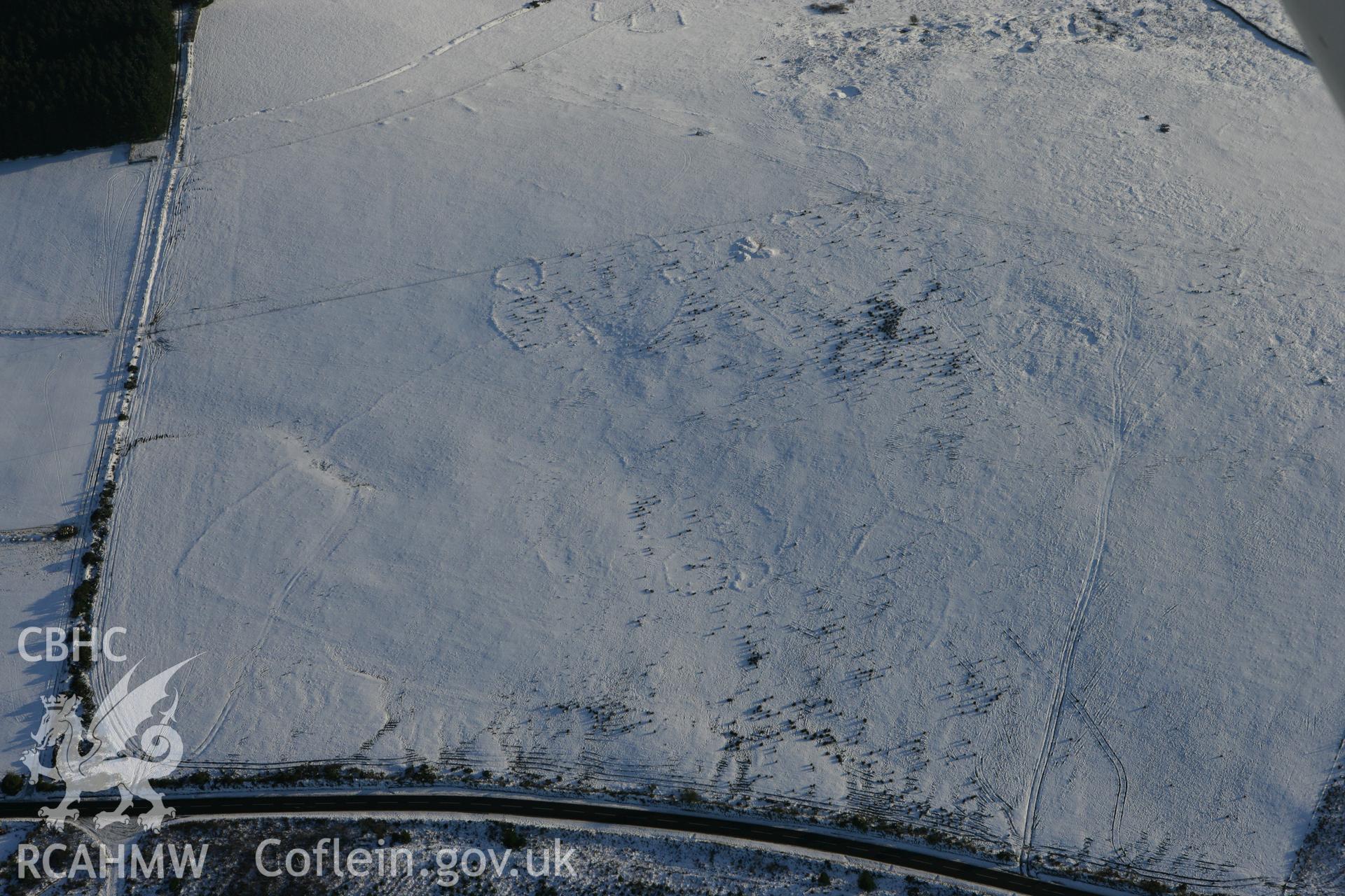 RCAHMW colour oblique photograph of Bernard's Well Mountain, prehistoric settlement, view from the north-west. Taken by Toby Driver on 01/12/2010.