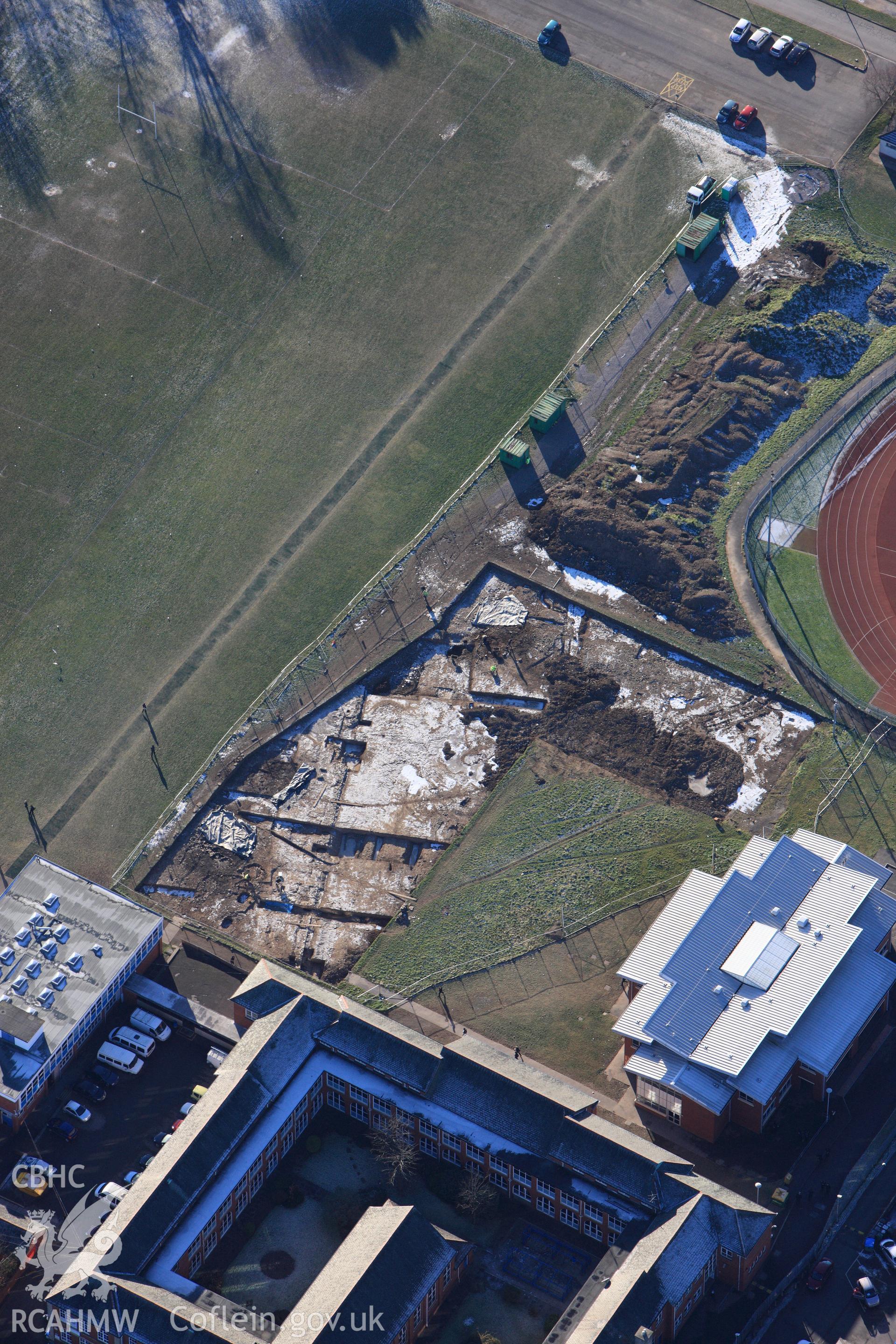 RCAHMW colour oblique photograph of Neath Auxiliary Fort, showing excavations. Taken by Toby Driver on 08/12/2010.