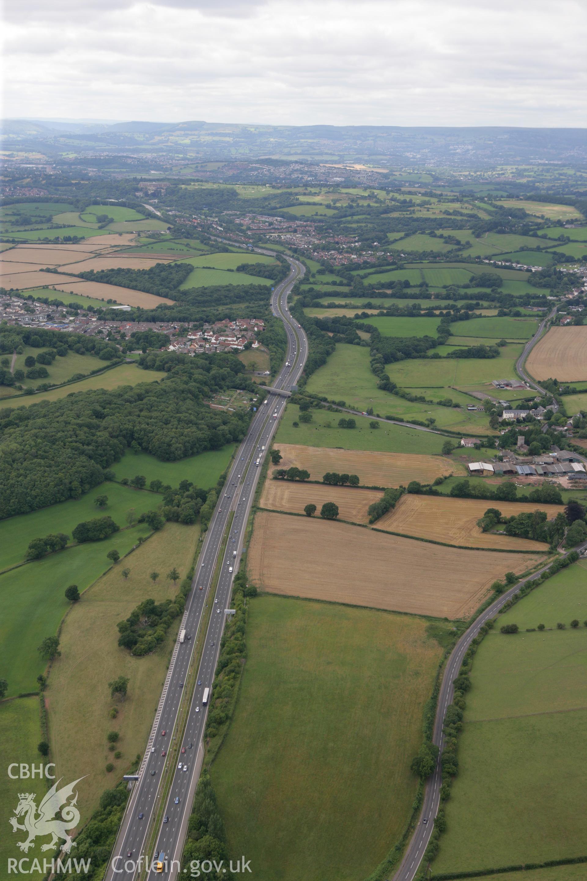 RCAHMW colour oblique photograph of Llanmartin, Underwood and Langstone looking west along the M4. Taken by Toby Driver on 29/07/2010.
