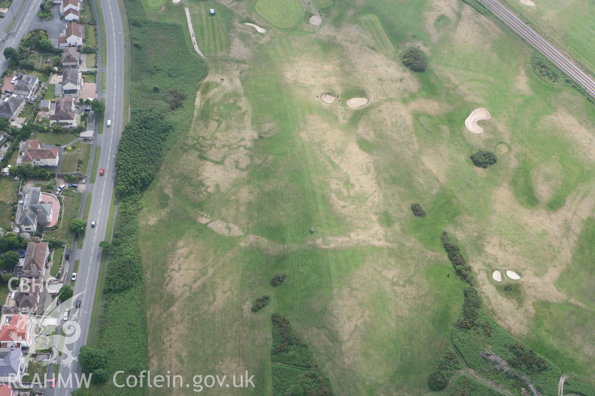 RCAHMW colour oblique photograph of Maesdu Golf course practice trenches. Taken by Toby Driver on 10/06/2010.