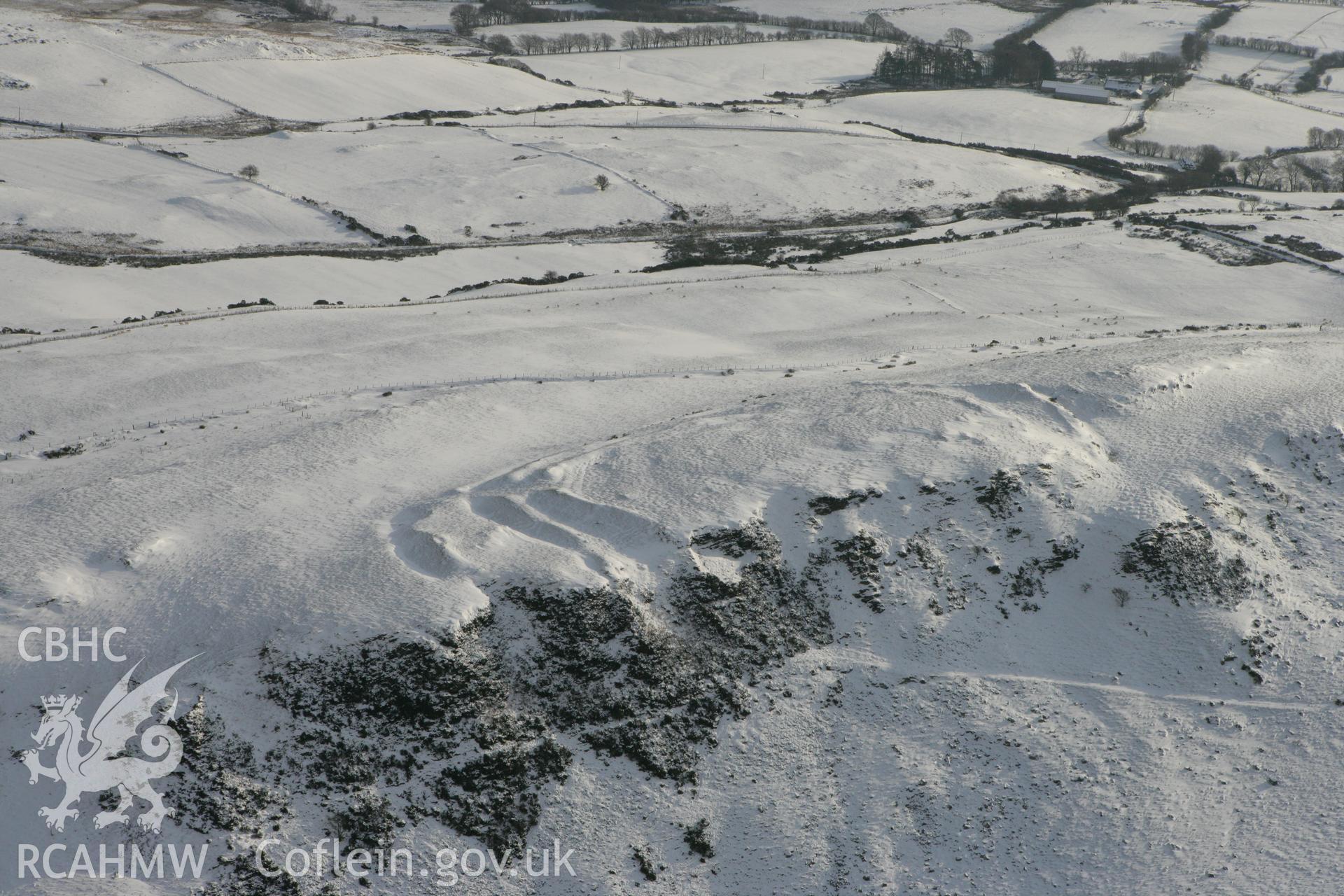 RCAHMW colour oblique photograph of Pen-y-ffrwd Llwyd hillfort. Taken by Toby Driver on 02/12/2010.