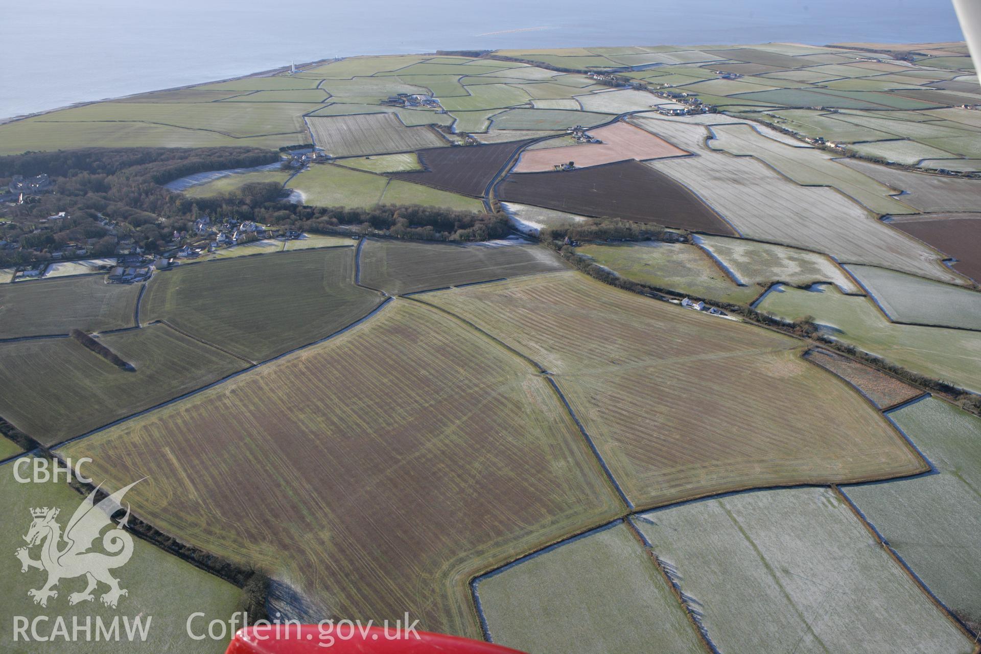 RCAHMW colour oblique photograph of St Donat's deserted village (site of). Taken by Toby Driver on 08/12/2010.