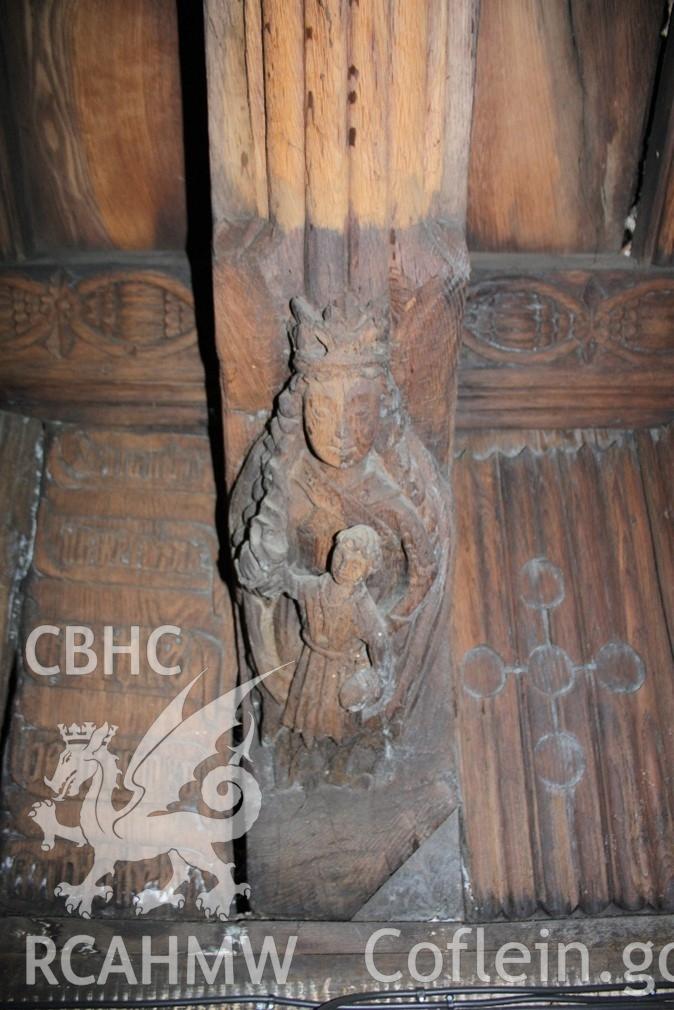 Carving of Virgin and Child on chancel wallplate at St Collen’s Church, Llangollen. RCAHMW investigator photograph by Richard Suggett, 10 Sept. 2020. As published in the RCAHMW volume, 'Temlau Peintiedig: Murluniau a Chroglenni yn Eglwysi Cymru, 1200–1800 / Painted Temples: Wallpaintings and Rood-screens in Welsh Churches, 1200–1800'. Figure 3.42, page 124.