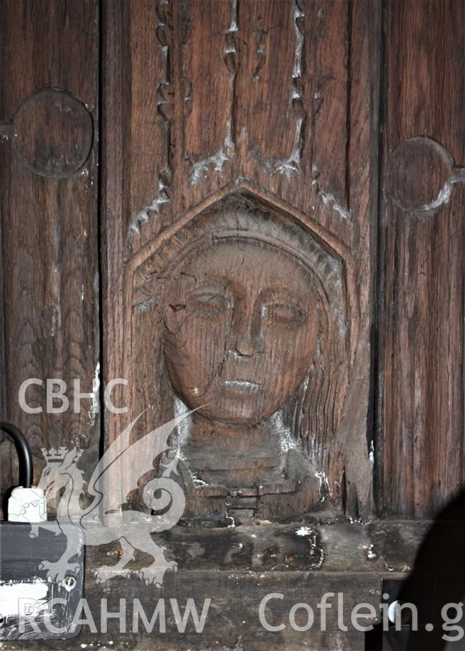 Carving of ?St Collen on chancel wallplate at St Collen’s Church, Llangollen. RCAHMW investigator photograph by Richard Suggett, 10 Sept. 2020. As published in RCAHMW volume, 'Temlau Peintiedig: Murluniau a Chroglenni yn Eglwysi Cymru, 1200–1800 / Painted Temples: Wallpaintings and Rood-screens in Welsh Churches, 1200–1800.' Figure 3.43, page 124.