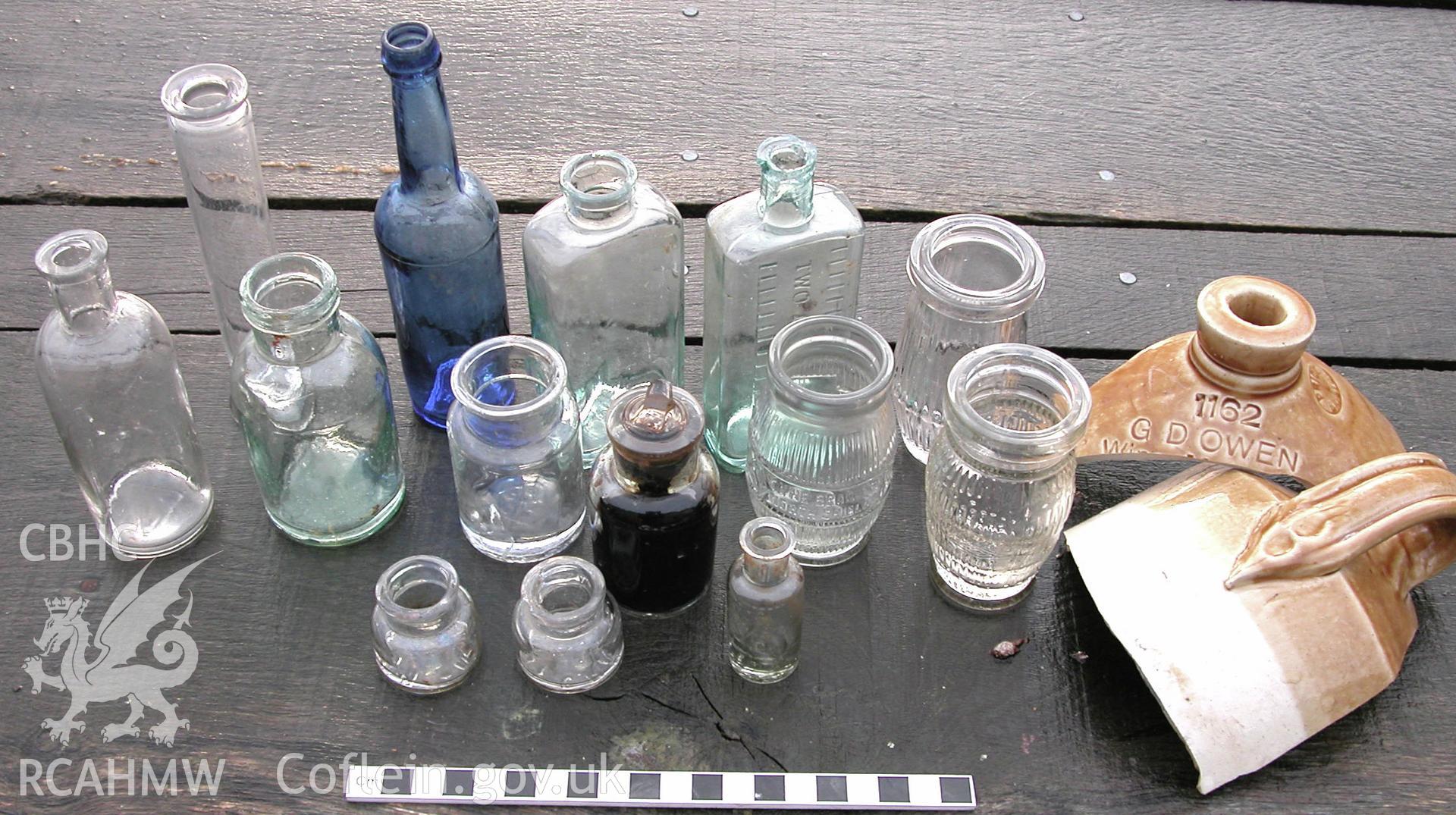 Digital colour photograph showing assemblage of bottles collected from the rubbish pits, at Tynllan, Llansilin, Oswestry (CAP Report 601), by Irma Bernardus.