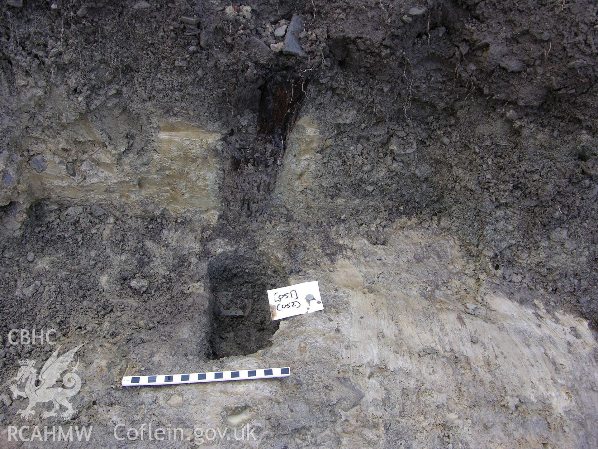 Colour digital photograph showing view of posthole with post - part of the Archaeological Excavation report for Horse Yard Farm, Evenjobb (CAP Report 607) by Chris E Smith, from a Cambrian Archaeological Projects assessment survey.