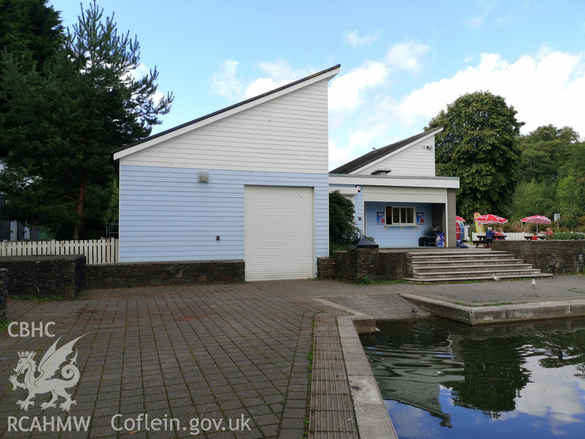 Blue and white building with outdoor seating in background at Cwmbran Park, photographed by Susan Fielding of RCAHMW on 12 September 2019.