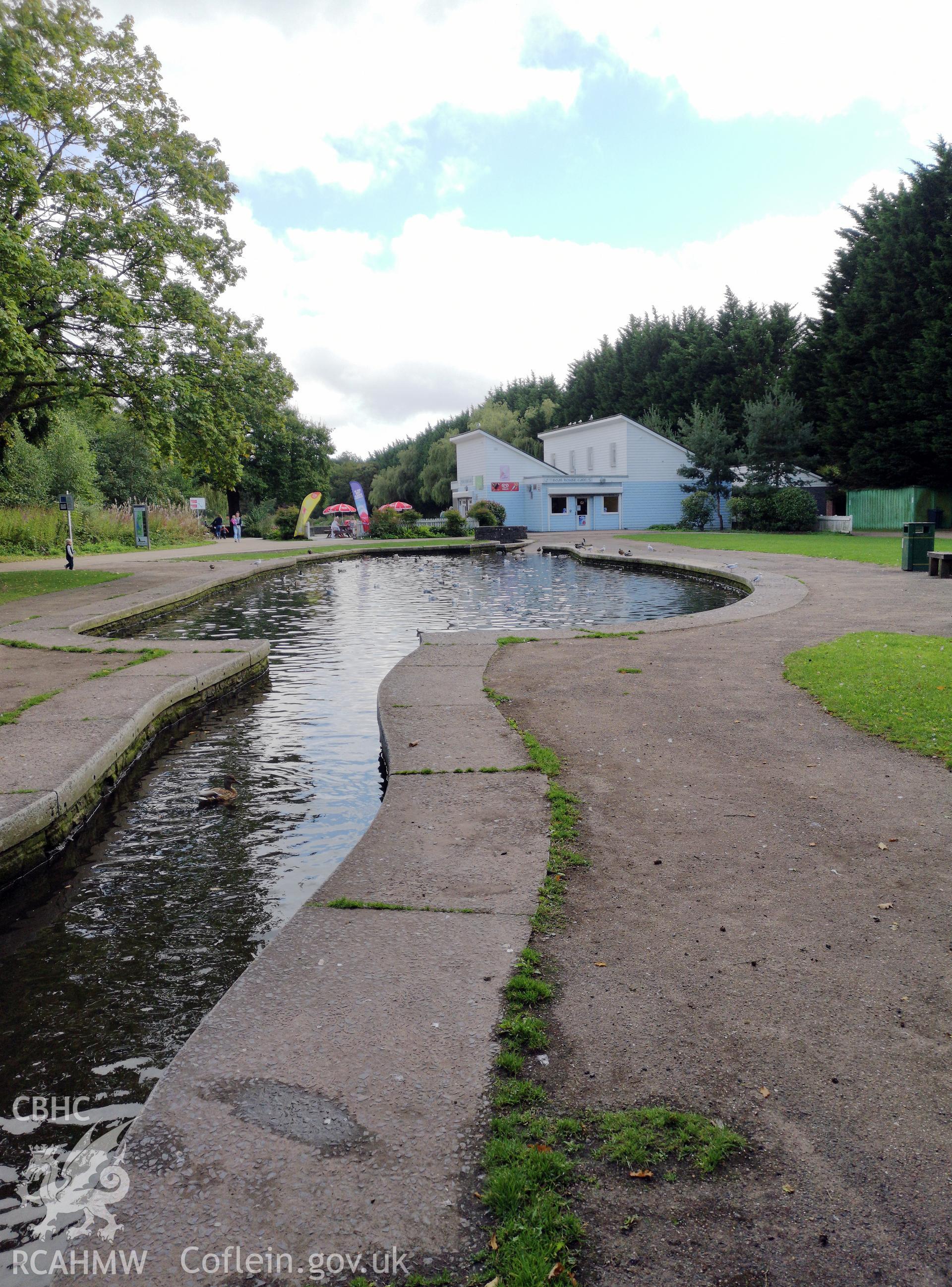Ornamental running water feature with blue and white building beyond at Cwmbran Park, photographed by Susan Fielding of RCAHMW on 12 September 2019.