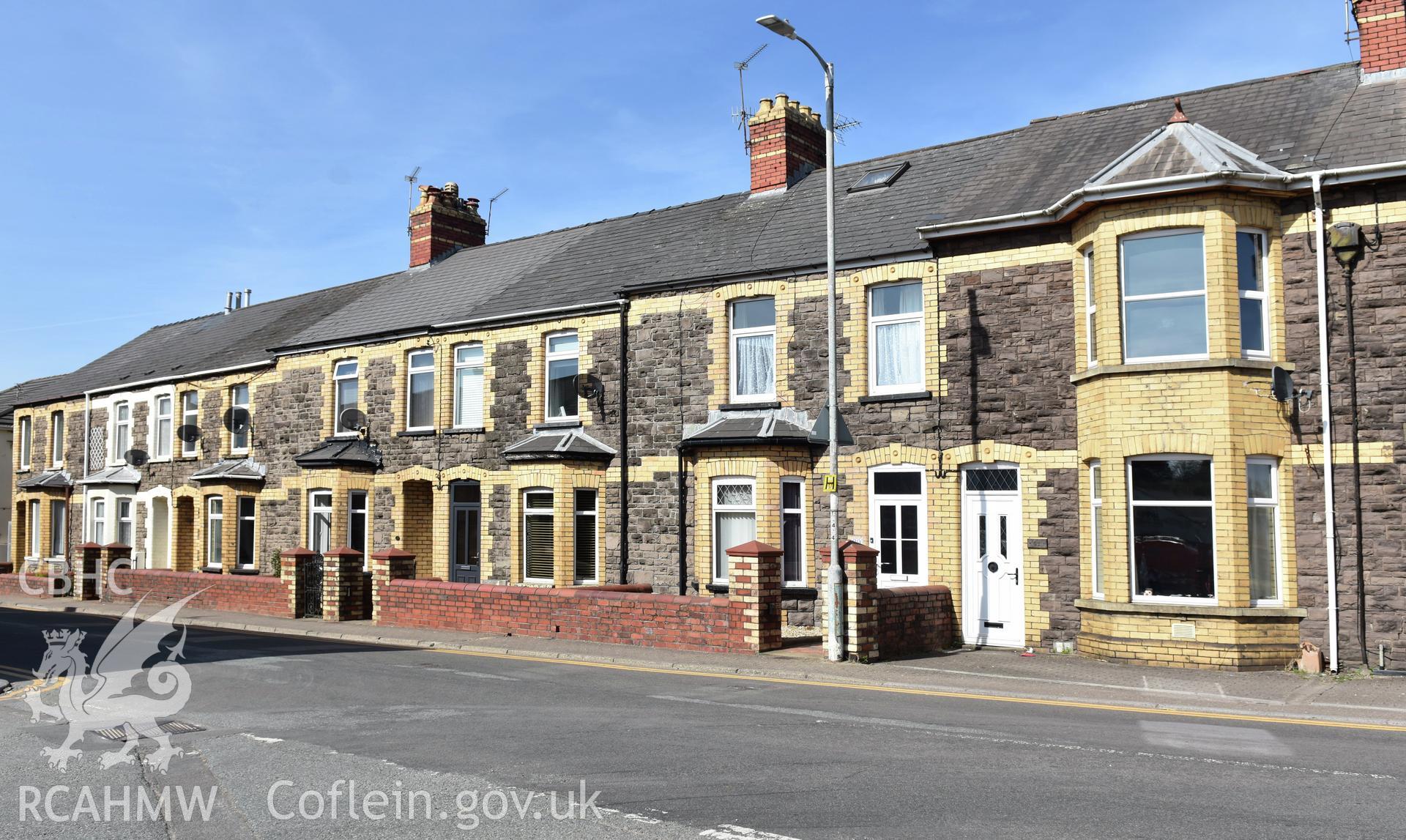 Exterior view showing front elevation of terraced housing on Victoria Street in the Oakfield Neighbourhood of Cwmbran, photographed by Susan Fielding of RCAHMW between 23 April 2021.