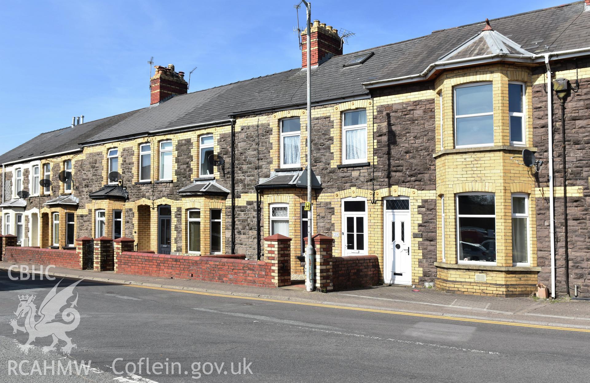 Exterior view showing front elevation of terraced housing on Victoria Street in the Oakfield Neighbourhood of Cwmbran, photographed by Susan Fielding of RCAHMW between 23 April 2021.