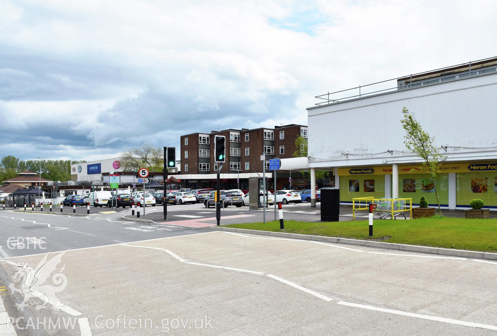 Exterior view of flats and shops in Cwmbran town centre, photographed by Susan Fielding of RCAHMW on 25 May 2021.