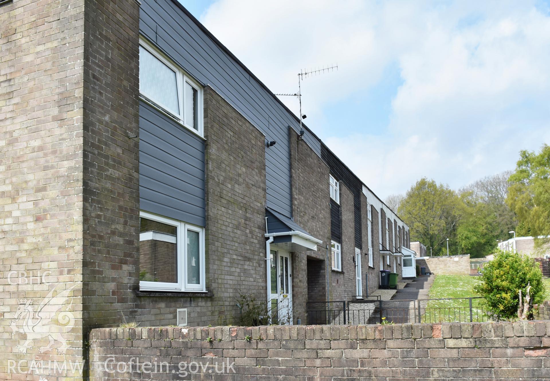 Exterior view showing front elevation of terraced housing at the Fairhill Estate in the Fairwater Neighbourhood of Cwmbran, photographed by Susan Fielding of RCAHMW on 1 May 2021.