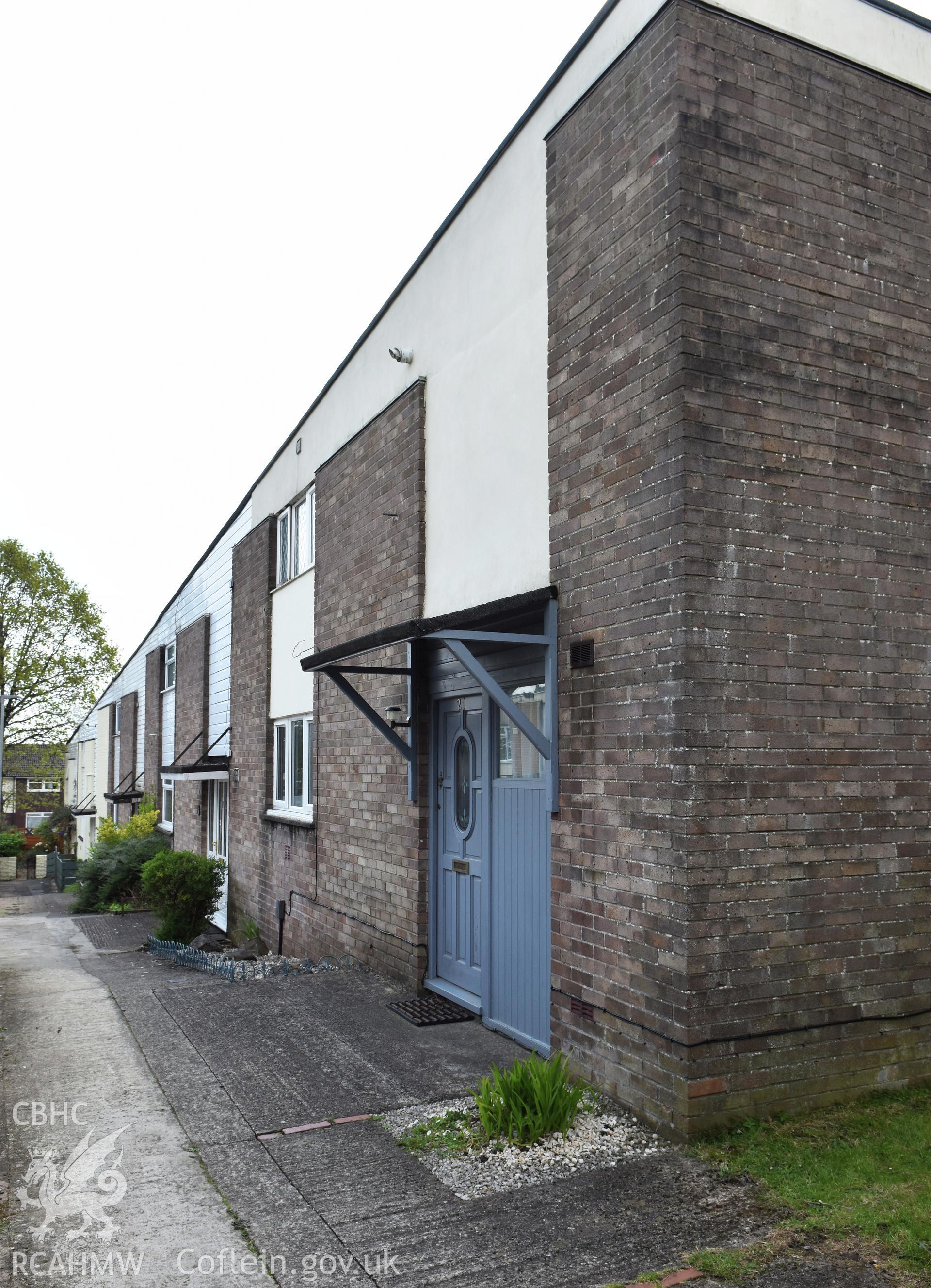 Exterior view showing front elevation of terraced housing at the Fairhill Estate in the Fairwater Neighbourhood of Cwmbran, photographed by Susan Fielding of RCAHMW on 1 May 2021.