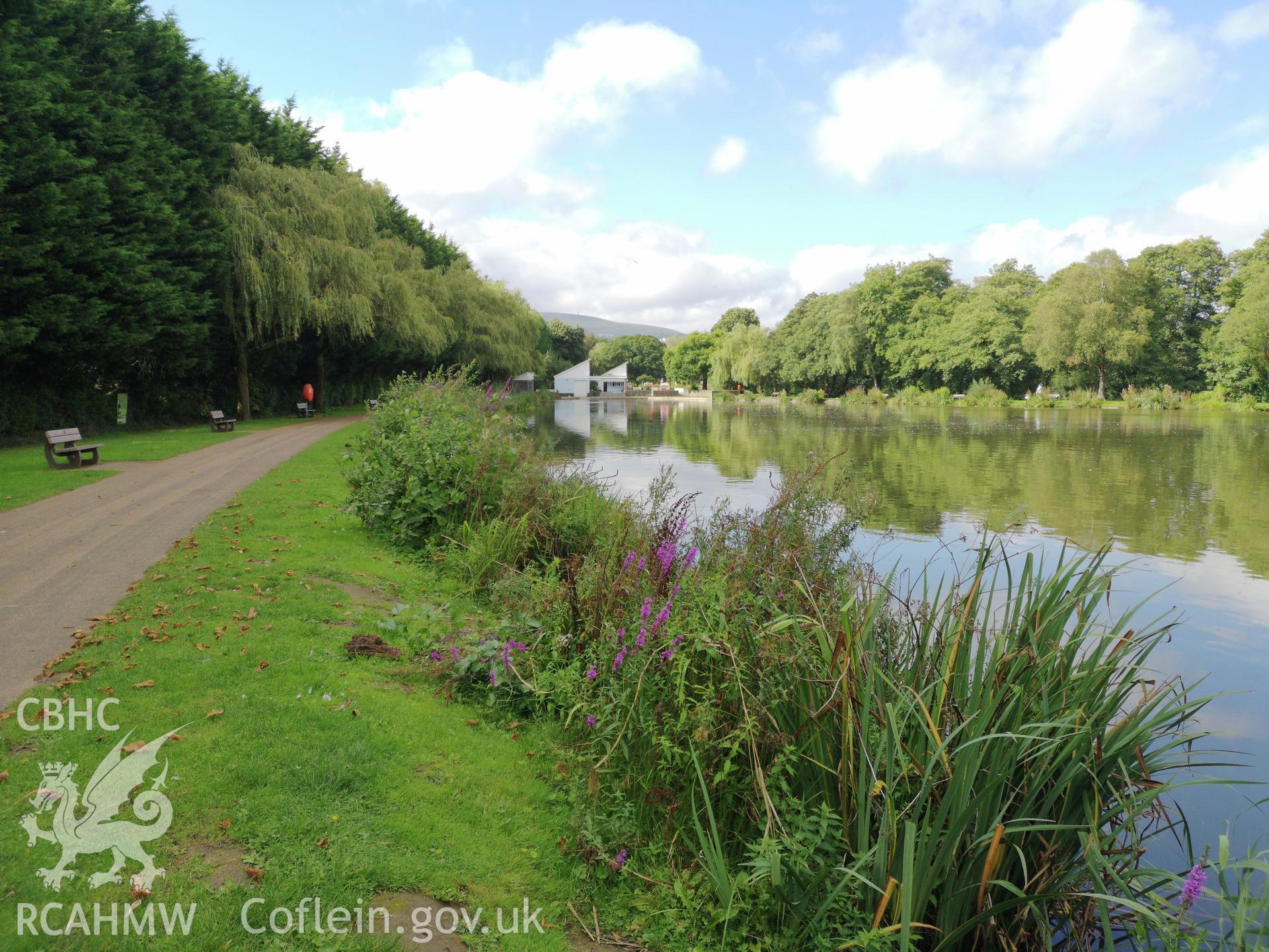 Pathway with benches along the water's edge at Cwmbran Park, photographed by Susan Fielding of RCAHMW on 12 September 2019.