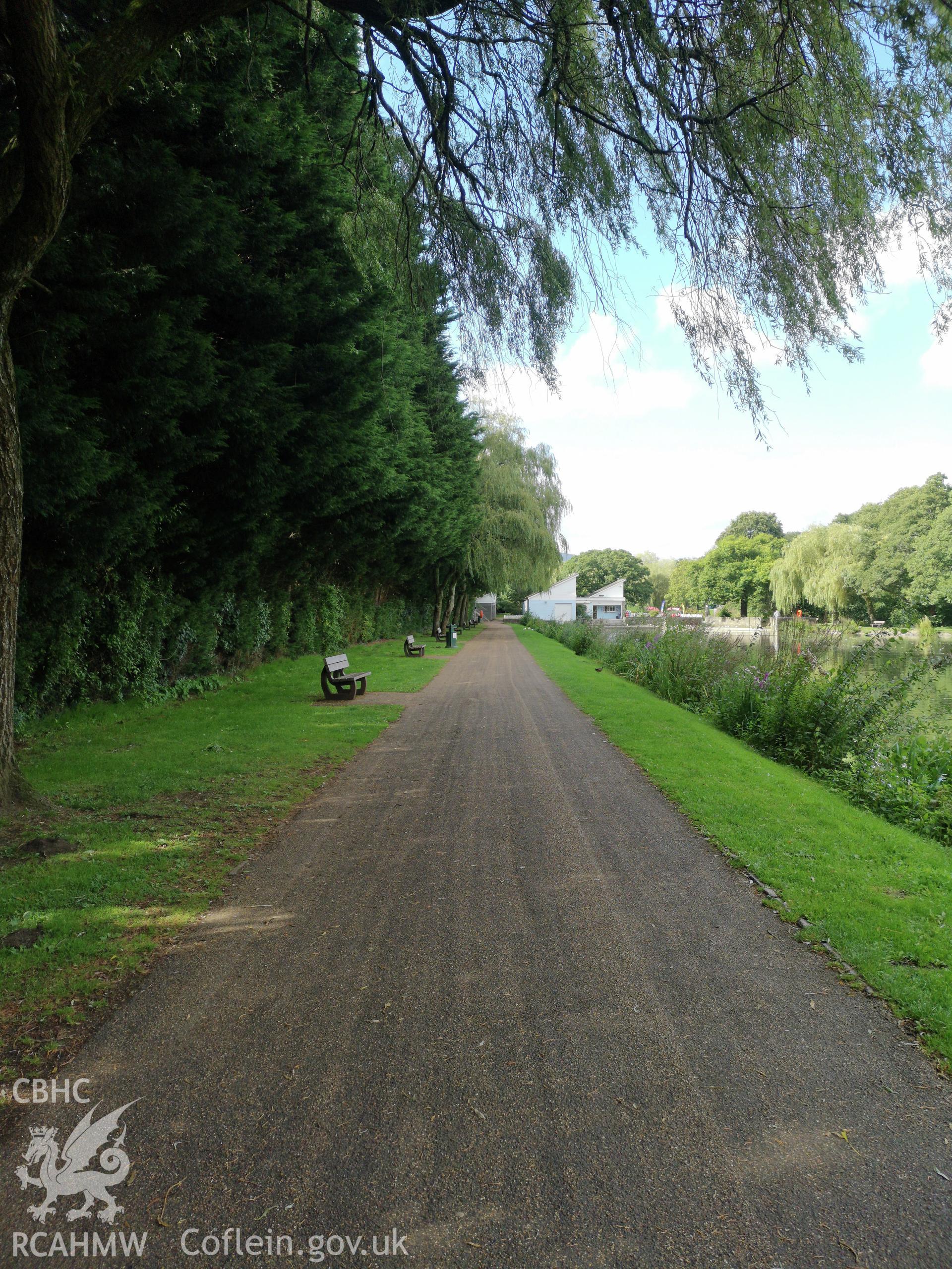 Pathway with benches along the water's edge at Cwmbran Park, photographed by Susan Fielding of RCAHMW on 12 September 2019.