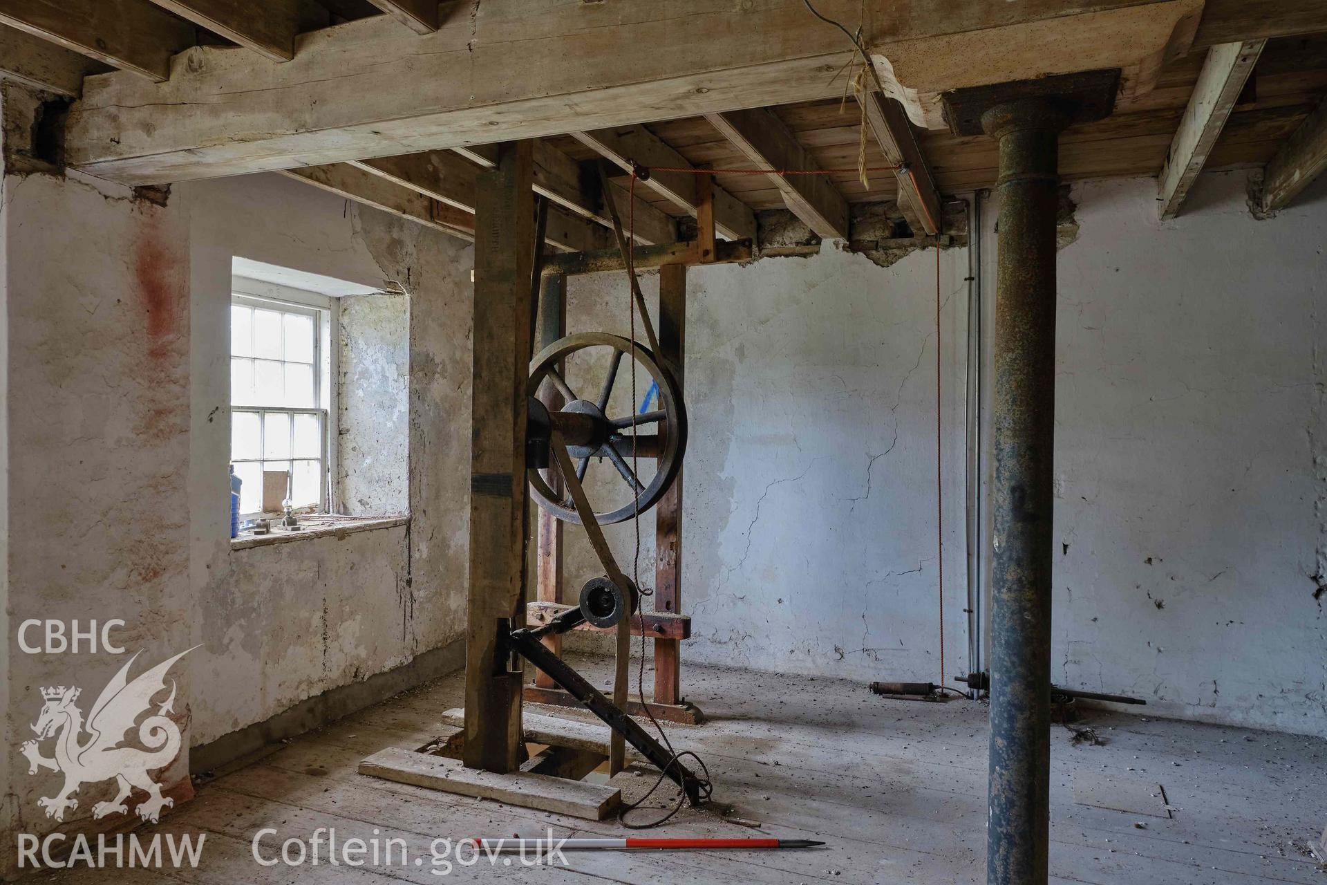 Colour photograph showing Blackpool Mill - 2nd floor, belt drive & wheels from electric motor, looking NE. Produced as part of Historic Building Recording for Blackpool Mill, carried out by Richard Hayman, June 2021.