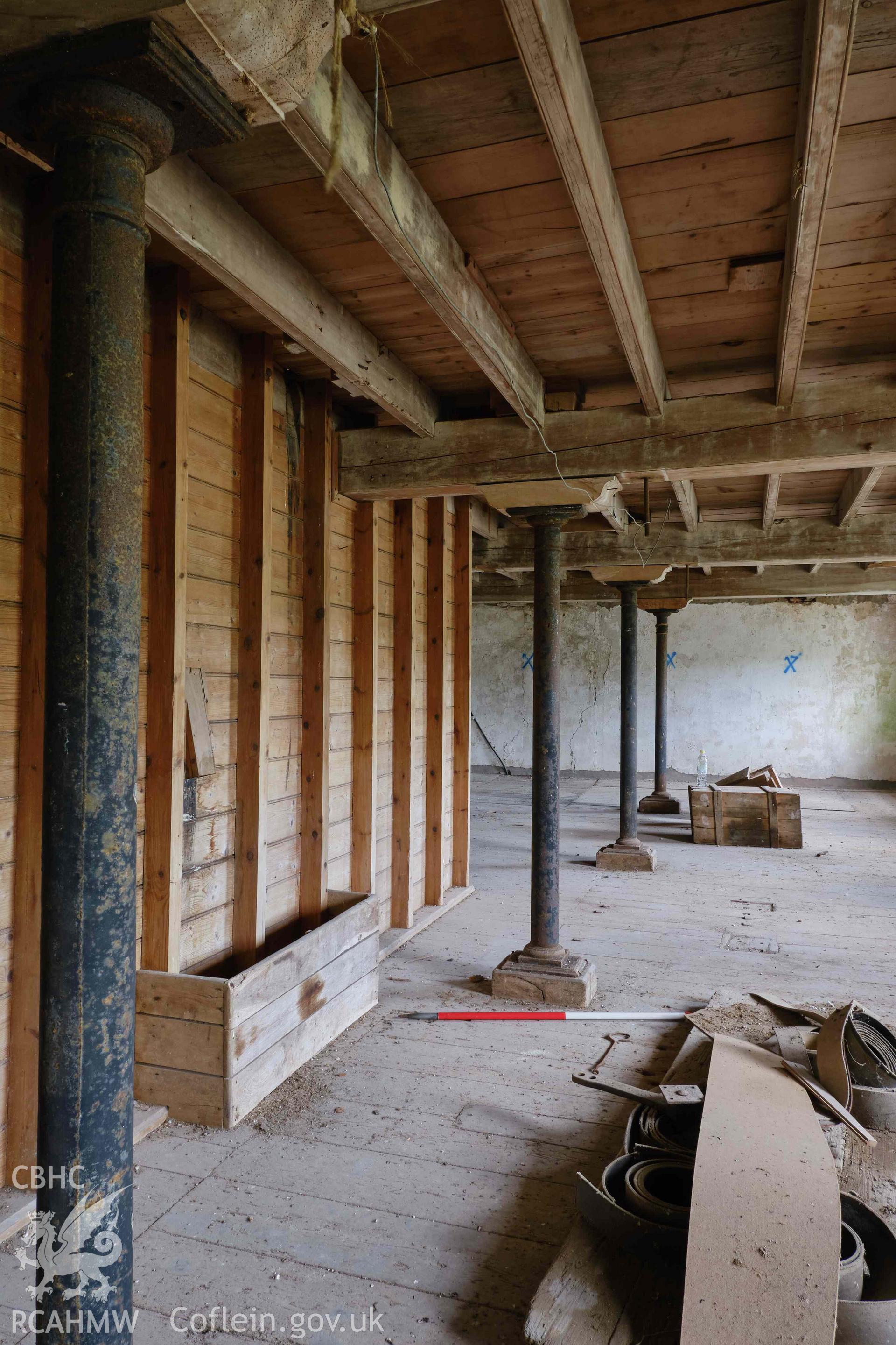 Colour photograph showing Blackpool Mill - 2nd floor, looking SE, with cast iron posts. Produced as part of Historic Building Recording for Blackpool Mill, carried out by Richard Hayman, June 2021.