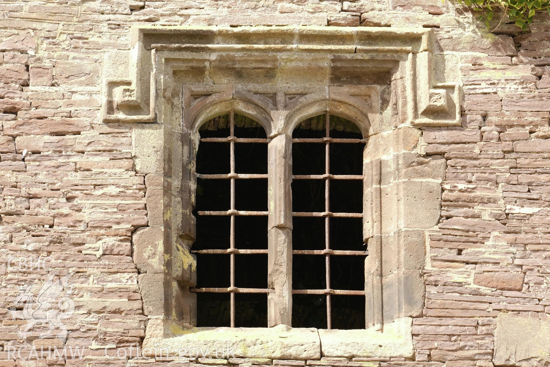 Colour photograph showing Great Porthmel Gatehouse - upper-stage window to SE front. Produced as part of Historic Building Recording for Great Porthamel Gatehouse, carried out by Richard Hayman, April 2021.