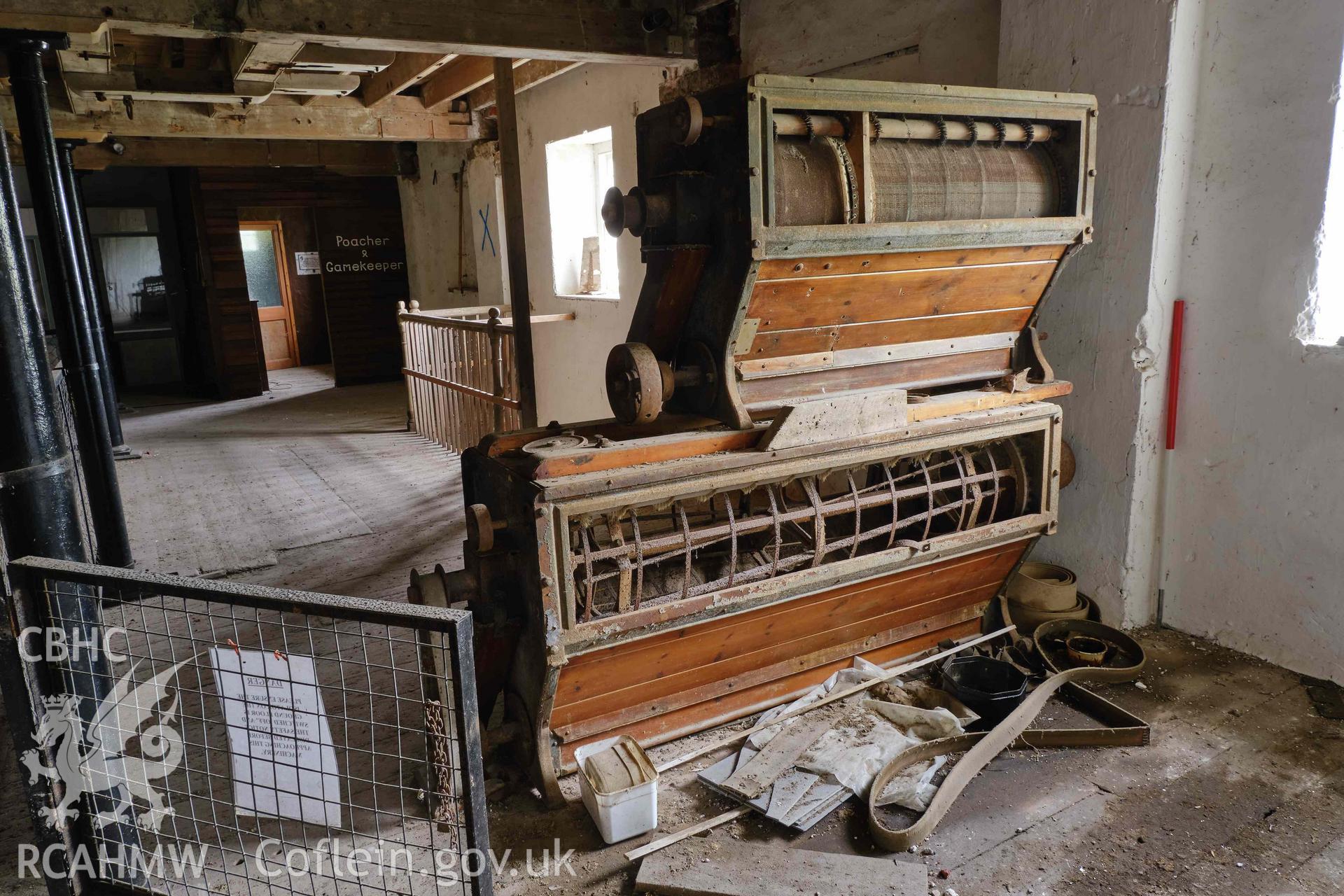 Colour photograph showing Blackpool Mill - 1st floor,  Armfield scalper, looking W. Produced as part of Historic Building Recording for Blackpool Mill, carried out by Richard Hayman, June 2021.
