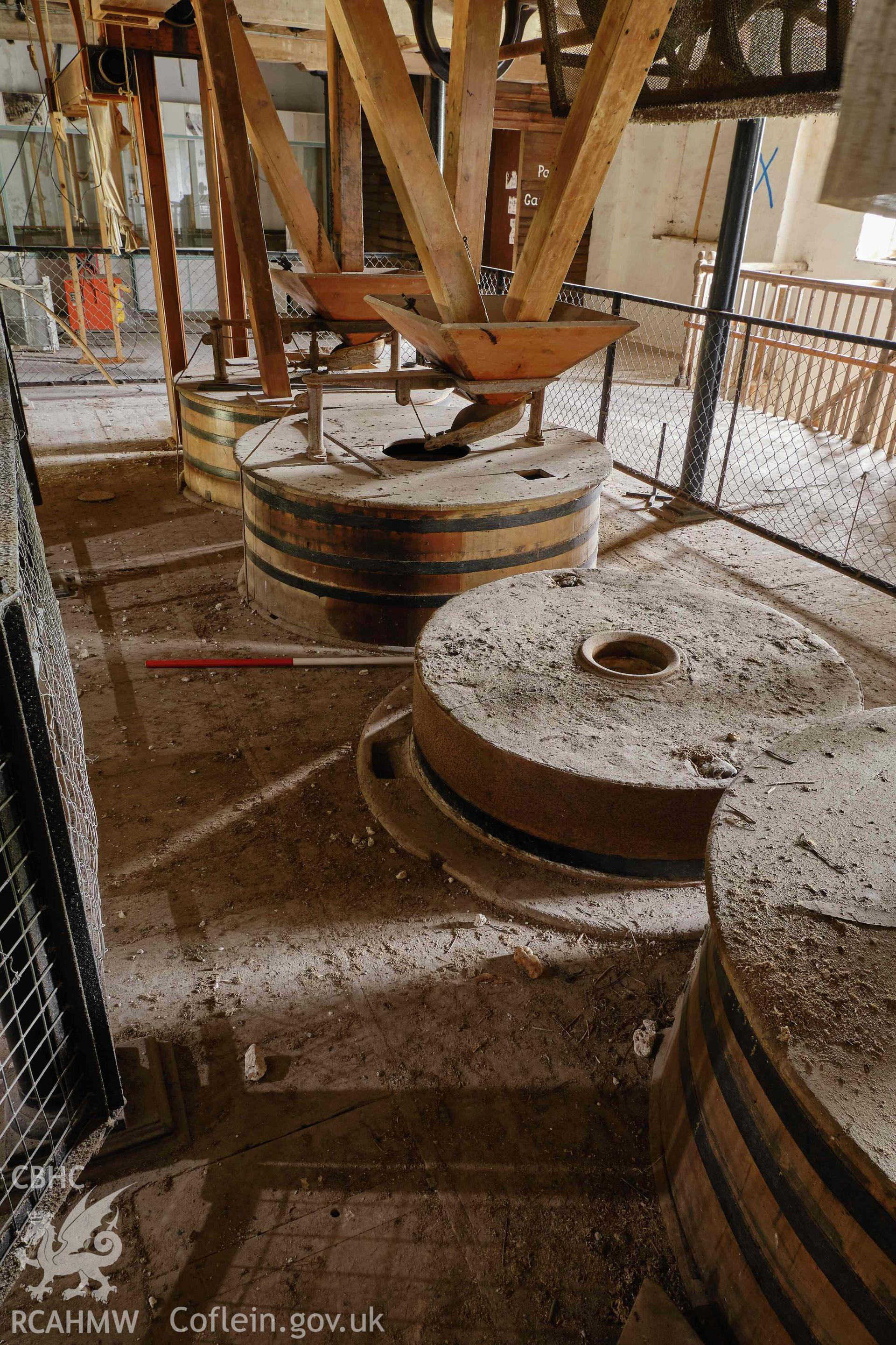 Colour photograph showing Blackpool Mill - 1st floor, millstones, looking W. Produced as part of Historic Building Recording for Blackpool Mill, carried out by Richard Hayman, June 2021.