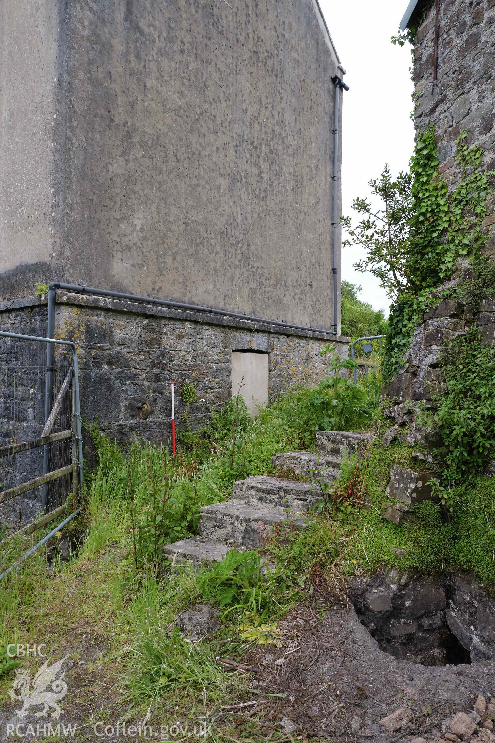 Colour photograph showing Blackpool Mill - SW gable end of SW wing, looking SE. Produced as part of Historic Building Recording for Blackpool Mill, carried out by Richard Hayman, June 2021.