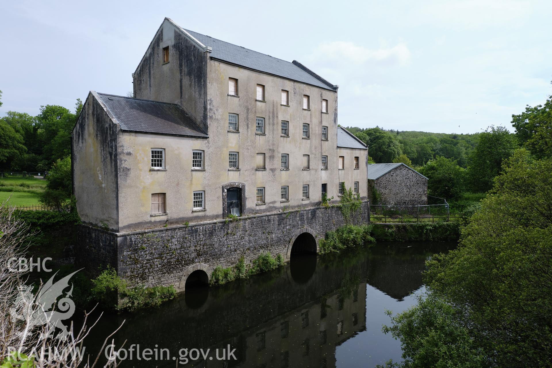 Colour photograph showing Blackpool Mill - mill & Eastern Cleddau, looking S. Produced as part of Historic Building Recording for Blackpool Mill, carried out by Richard Hayman, June 2021.
